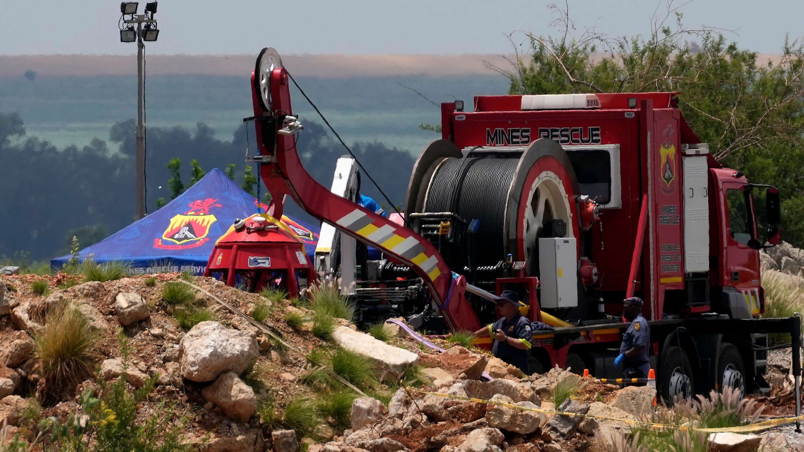 Rescuers work to retrieve miners from ground in an abandoned gold mine for months, in Stilfontein, South Africa, Tuesday, Jan. 14, 2025. (AP Photo/Themba Hadebe)