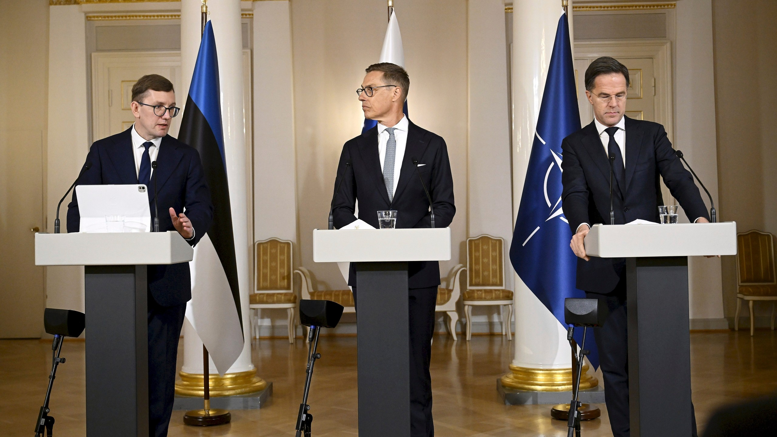 From left, Estonian Prime Minister Kristen Michal, Finnish President Alexander Stubb and Nato's Secretary General Mark Rutte address the media during a joint press conference as part of a summit of the Baltic Sea NATO countries in Helsinki, Finland, Tuesday, Jan. 14, 2025. (Antti Aimo-Koivisto/Lehtikuva via AP)