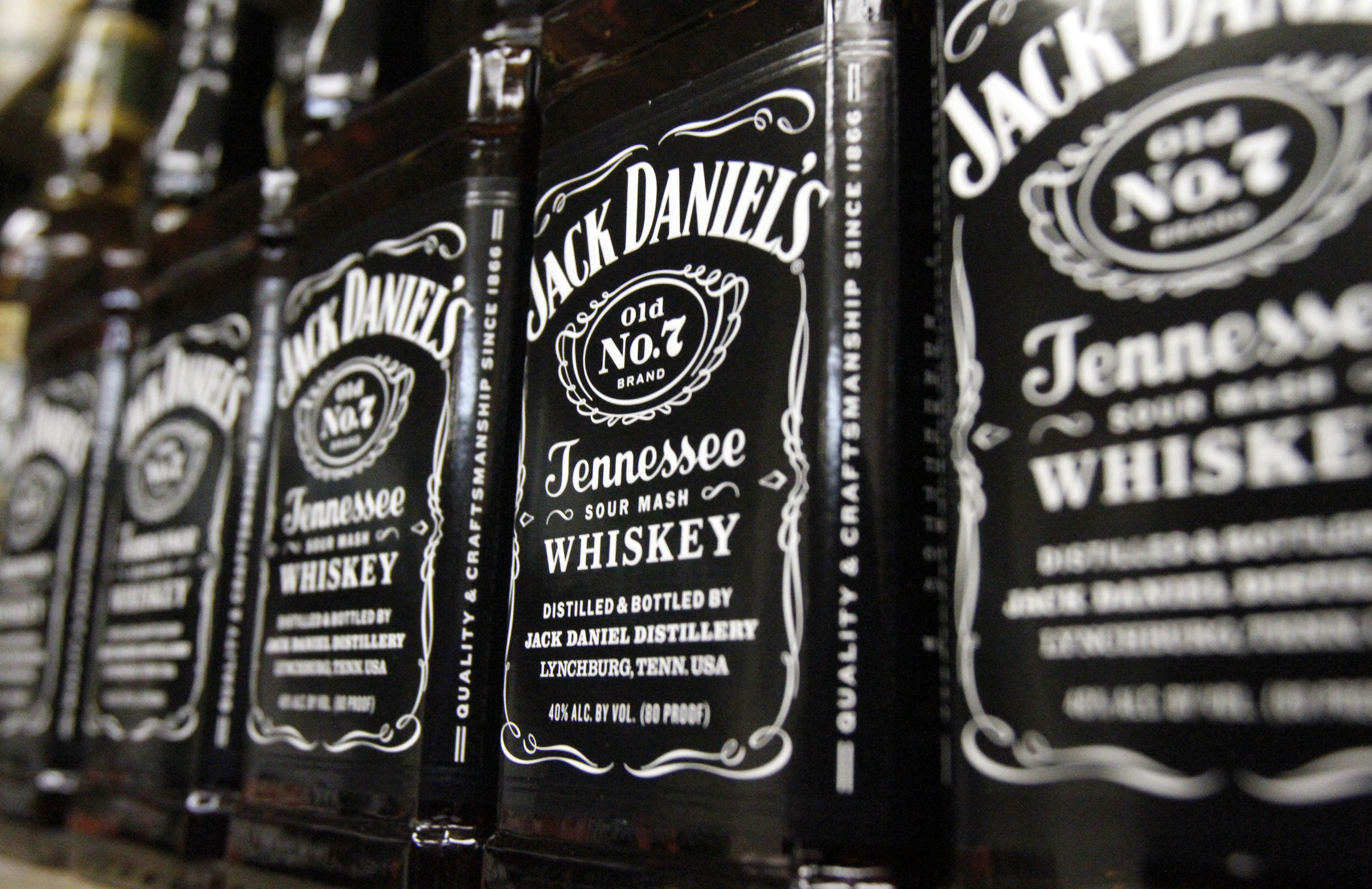 FILE - Bottles of Jack Daniel's Tennessee Whiskey line the shelves of a liquor outlet in Montpelier, Vt., Dec. 5, 2011. (AP Photo/Toby Talbot, File)