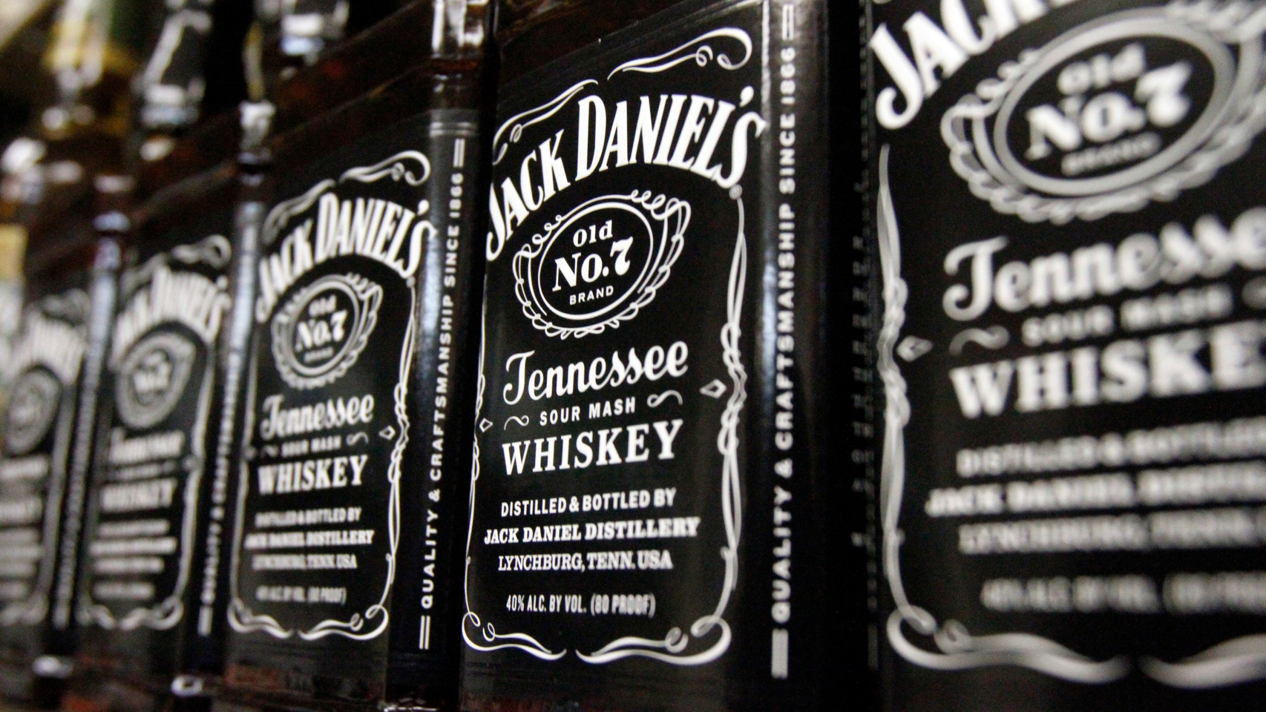 FILE - Bottles of Jack Daniel's Tennessee Whiskey line the shelves of a liquor outlet in Montpelier, Vt., Dec. 5, 2011. (AP Photo/Toby Talbot, File)