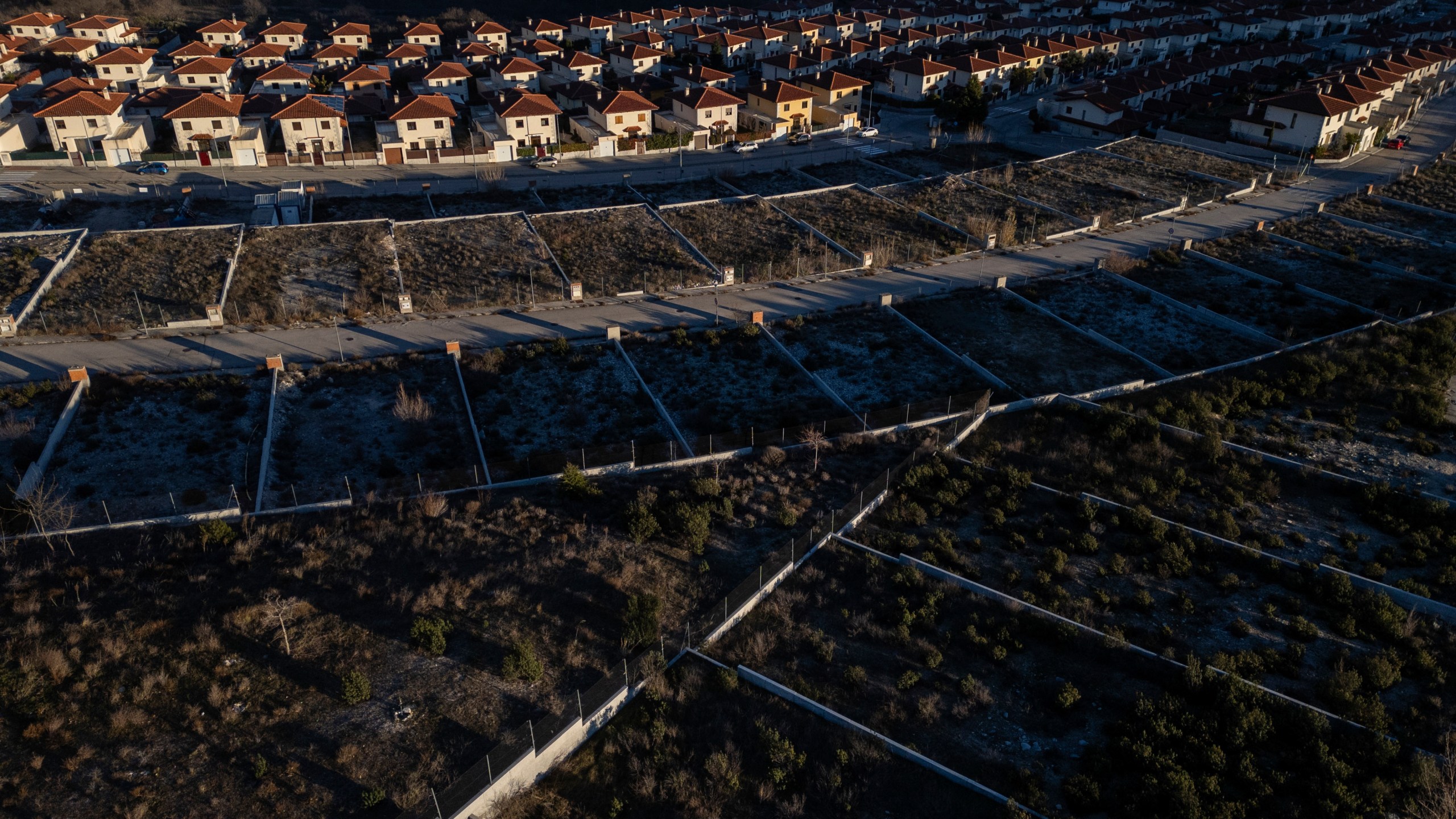 General view of developable plots in a residential area of the village of Bustarviejo, outskirts of Madrid, Spain, Tuesday, Jan. 14, 2025. (AP Photo/Bernat Armangue)