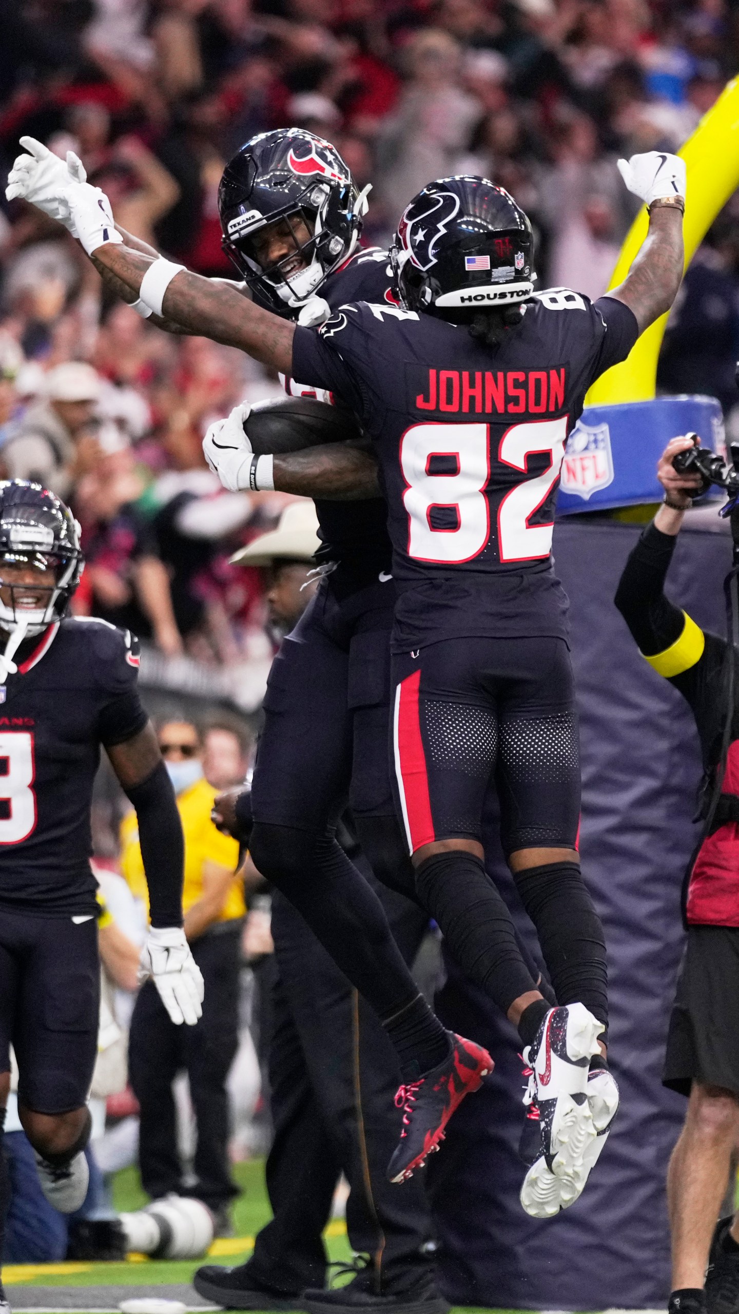 Houston Texans wide receiver Nico Collins, rear, celebrates with Diontae Johnson (82) after scoring a touchdown against the Los Angeles Chargers during the first half of an NFL wild-card playoff football game Saturday, Jan. 11, 2025, in Houston. (AP Photo/Eric Christian Smith)