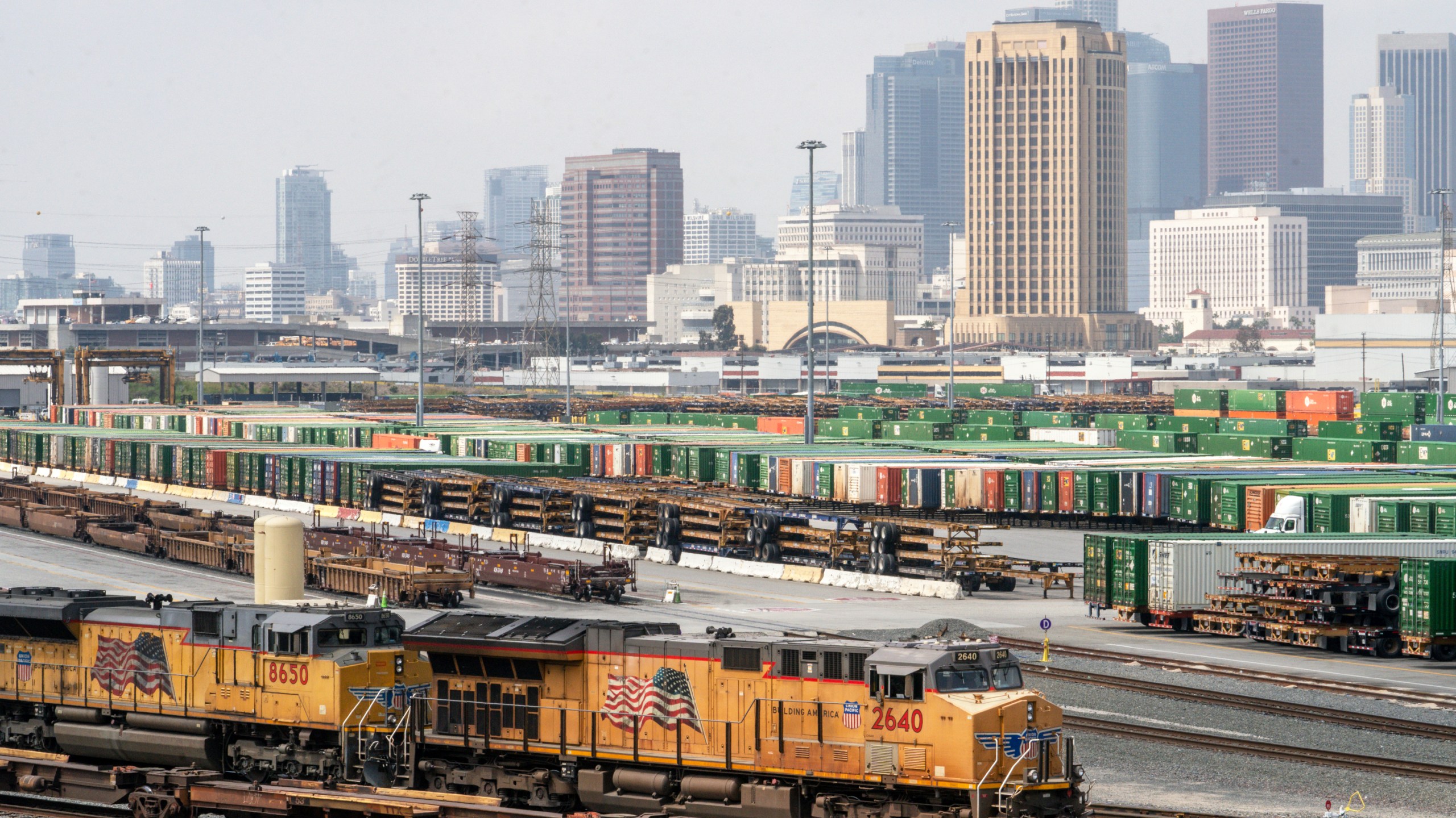 FILE - The Los Angeles skyline is seen above the Union Pacific LATC Intermodal Terminal on April 25, 2023, in Los Angeles. (AP Photo/Damian Dovarganes, File)