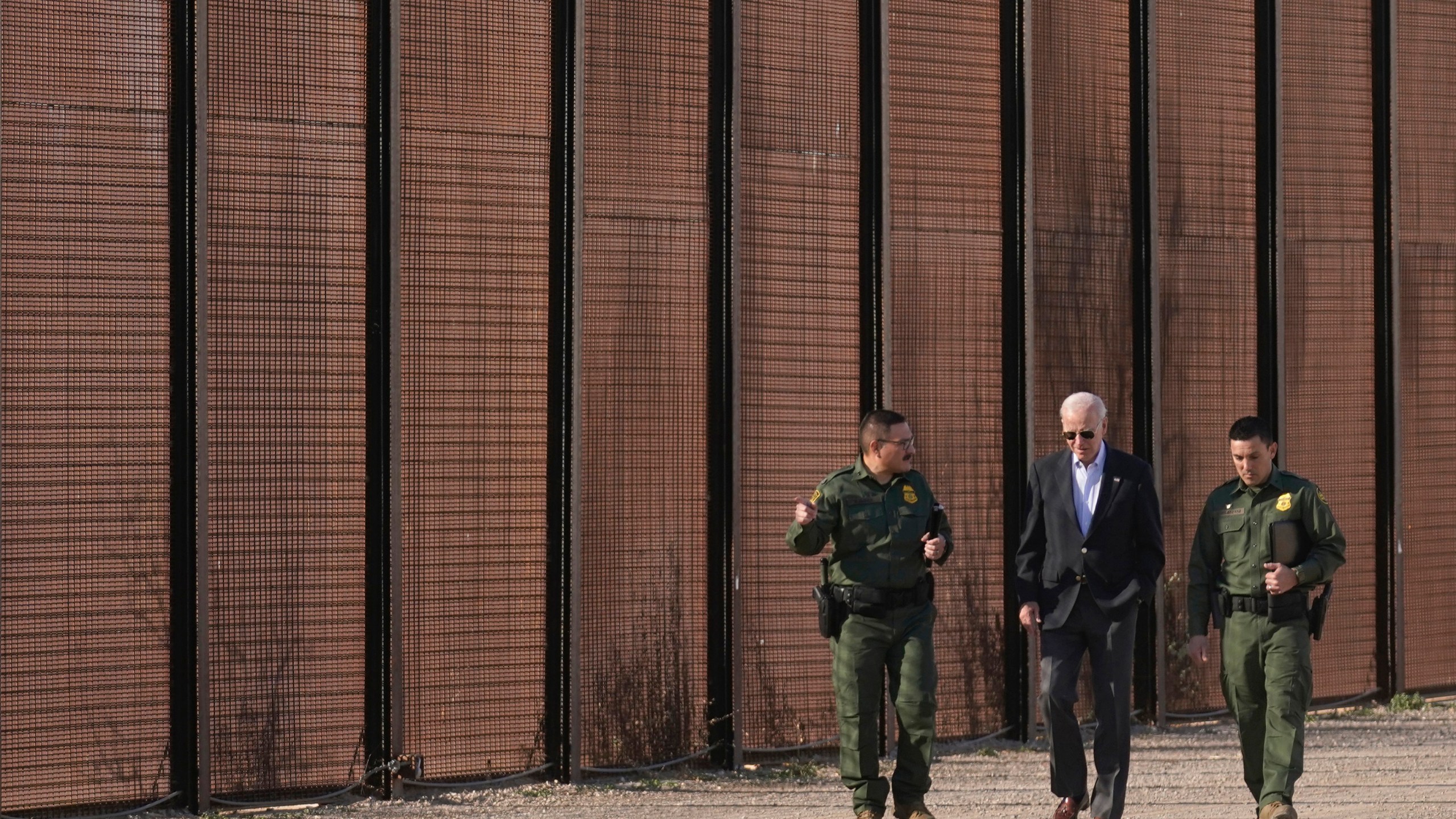 FILE - President Joe Biden walks with U.S. Border Patrol agents along a stretch of the U.S.-Mexico border in El Paso Texas, Jan. 8, 2023. (AP Photo/Andrew Harnik, File)