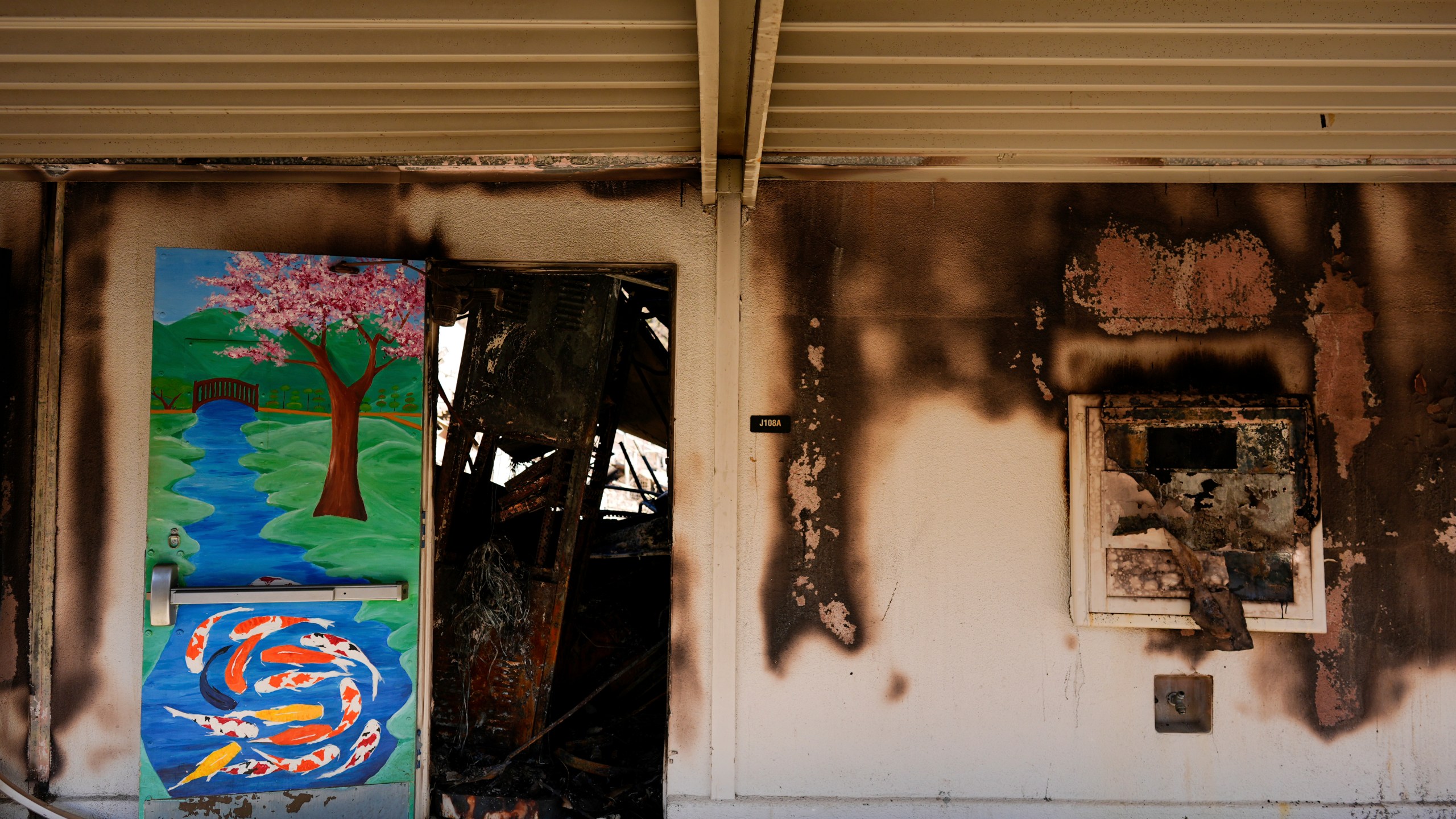 The entrance to a classroom is seen at Palisades High School in the aftermath of the Palisades Fire in the Pacific Palisades neighborhood of Los Angeles, Tuesday, Jan. 14, 2025. (AP Photo/Carolyn Kaster)