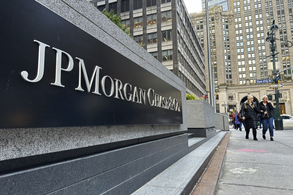 FILE - Pedestrians approach JP Morgan Chase headquarters, Wednesday, Dec. 29, 2023, in New York. (AP Photo/Peter Morgan, File)