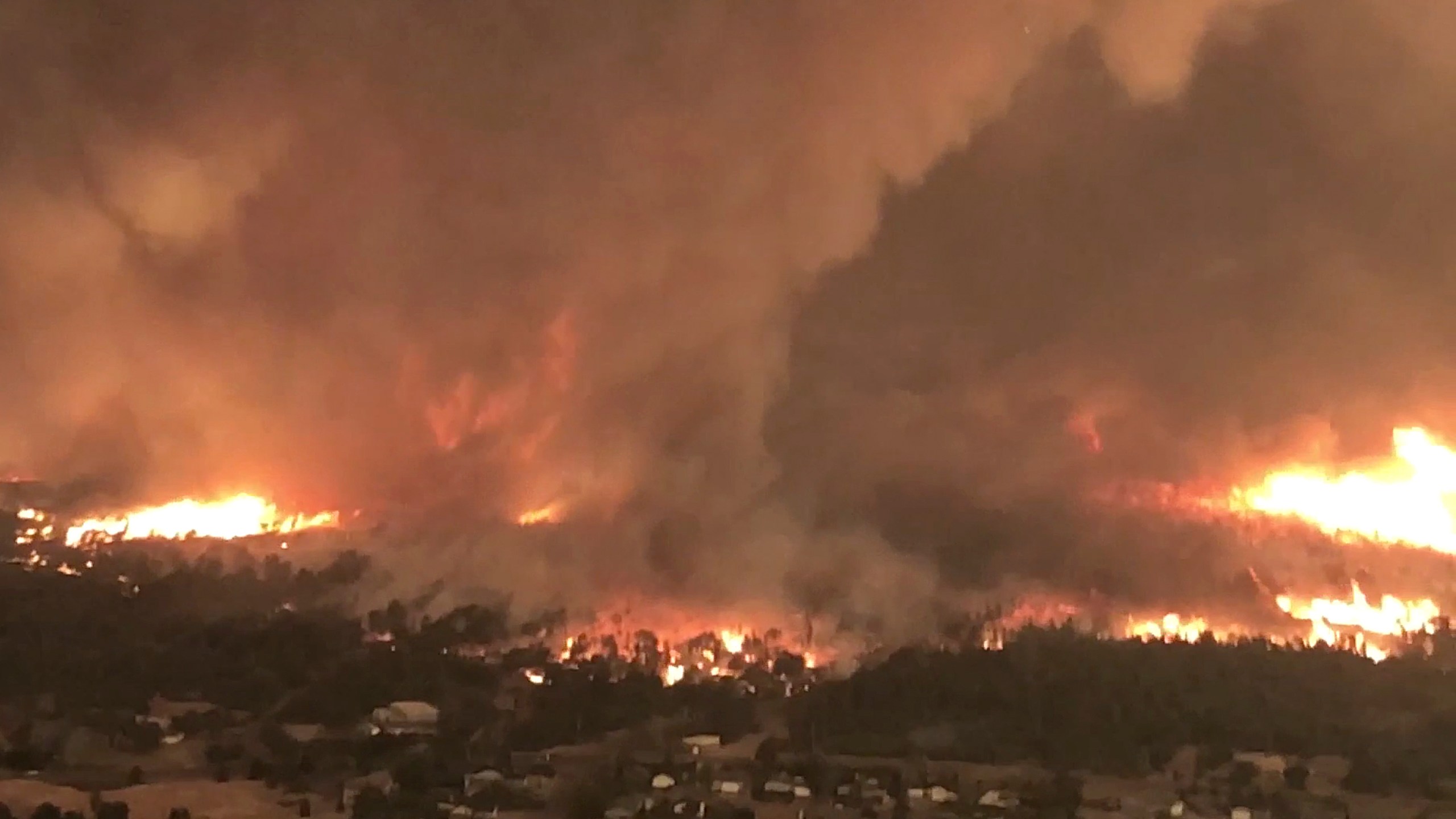 FILE - This image taken from video released by Cal Fire shows a fire tornado over Lake Keswick Estates, on July 26, 2018, near Redding, Calif. (Cal Fire via AP, File)