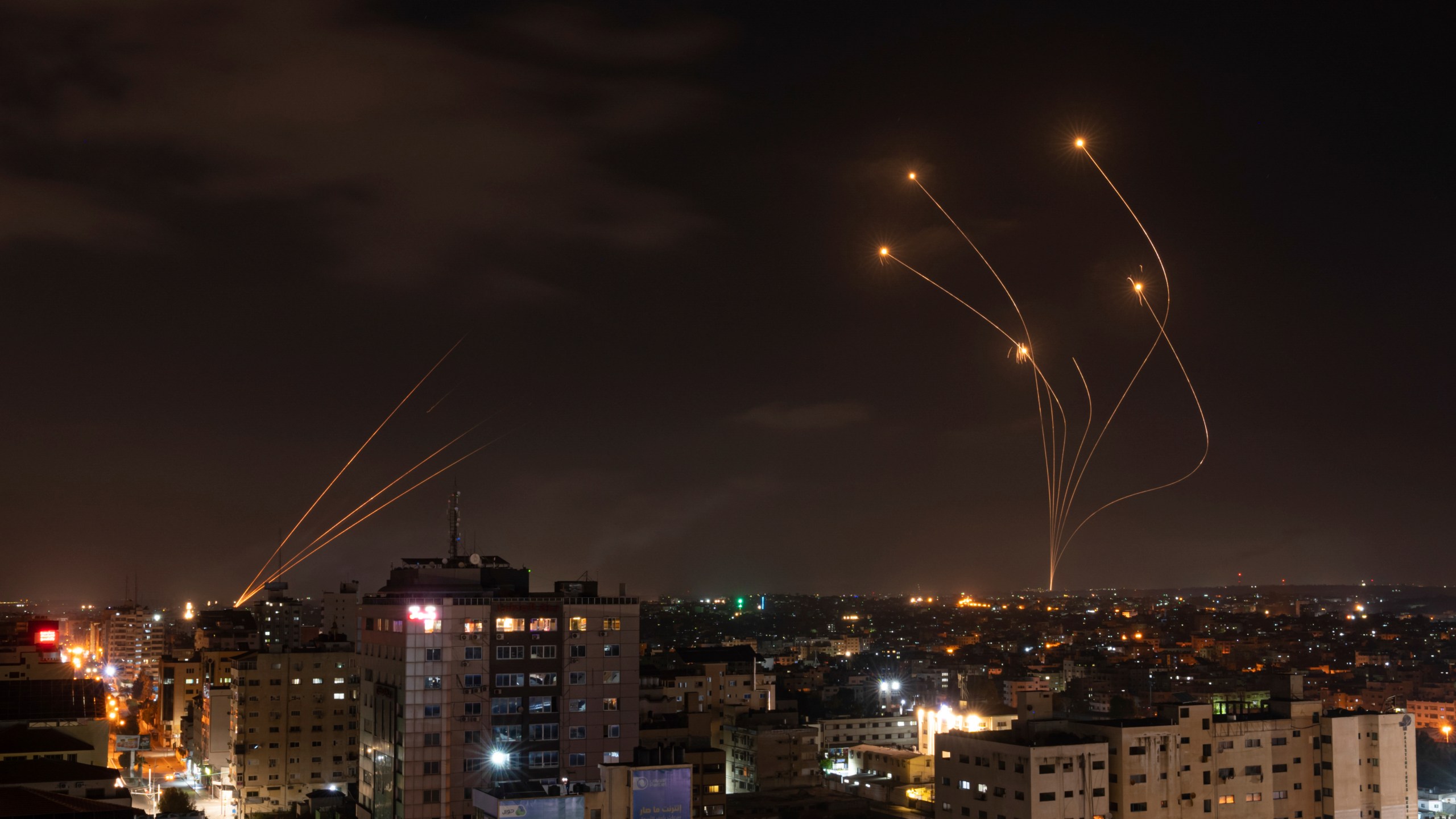 FILE - Rockets fired from Gaza and intercepted by Israel's Iron Dome anti-missile system over Israeli skies are seen from Gaza City, on May 13, 2023. (AP Photo/Fatima Shbair, File)