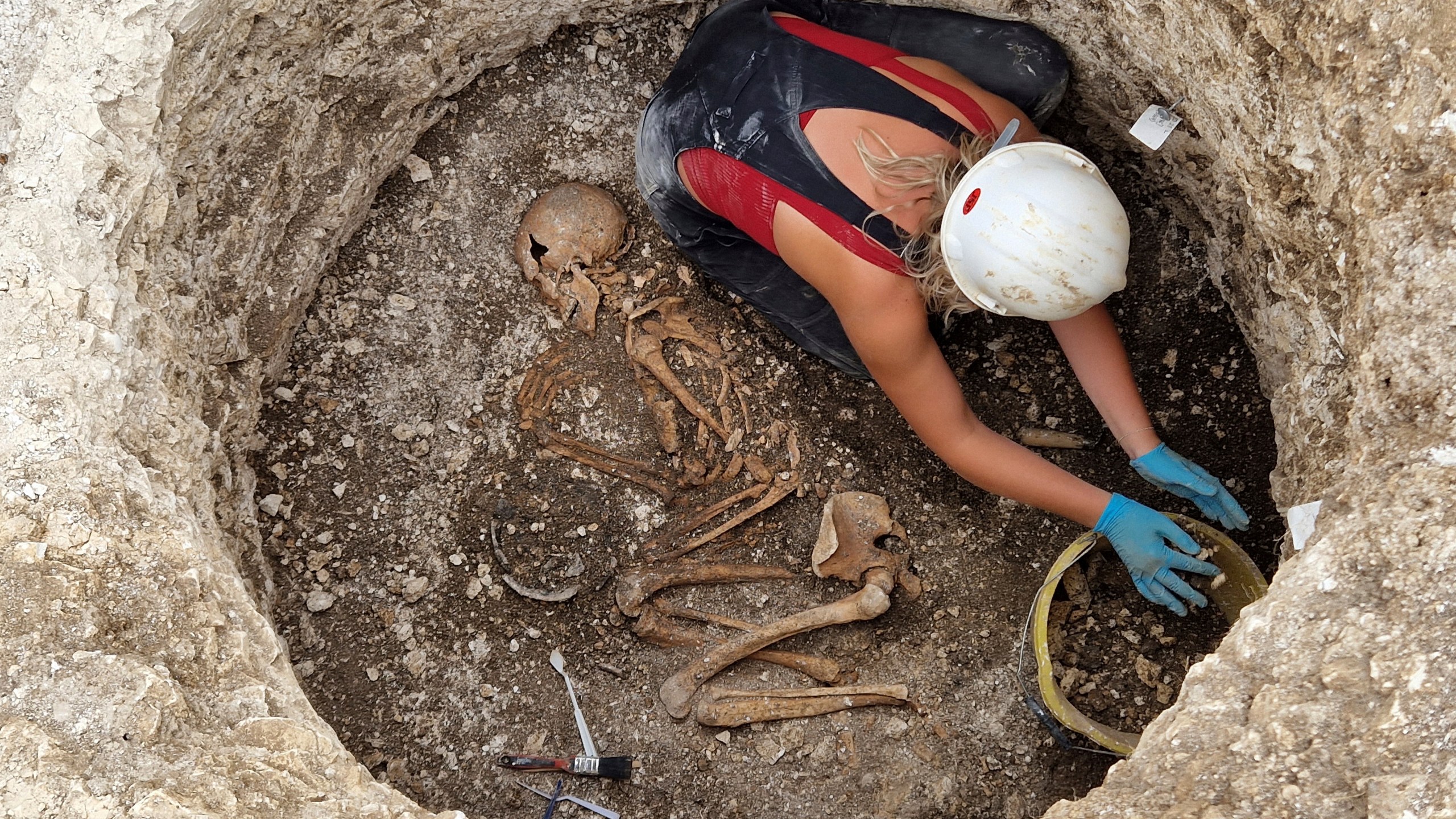 This photo provided by Bournemouth University in January 2025 shows burials being investigated at an Iron Age Celtic cemetery as part of the Durotriges tribe project dig in Dorset, southwest England. (Bournemouth University via AP)