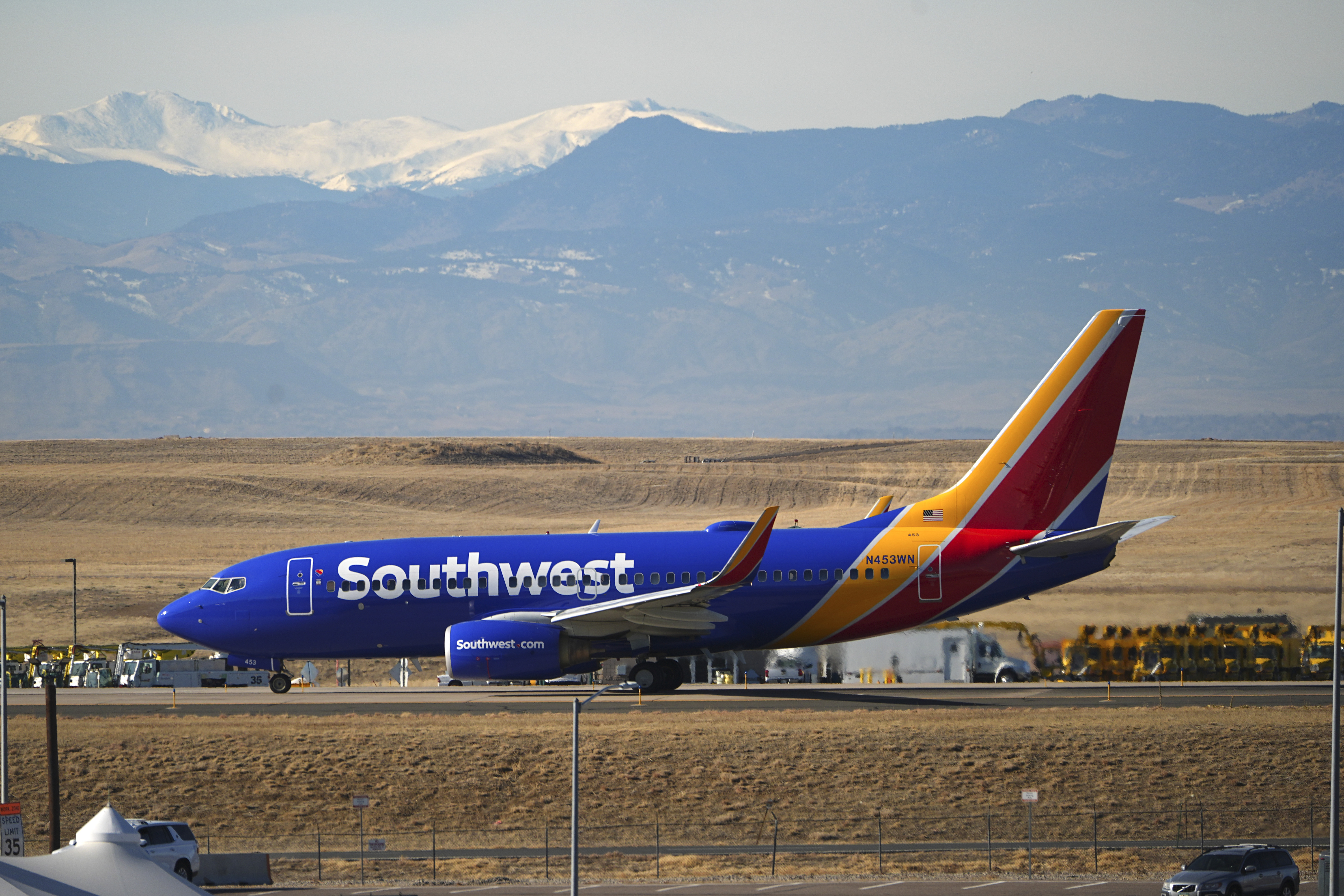 Southwest Airlines jetliner taxis down a runway for take off at Denver International Airport, Tuesday, Dec. 24, 2024, in Denver. (AP Photo/David Zalubowski)