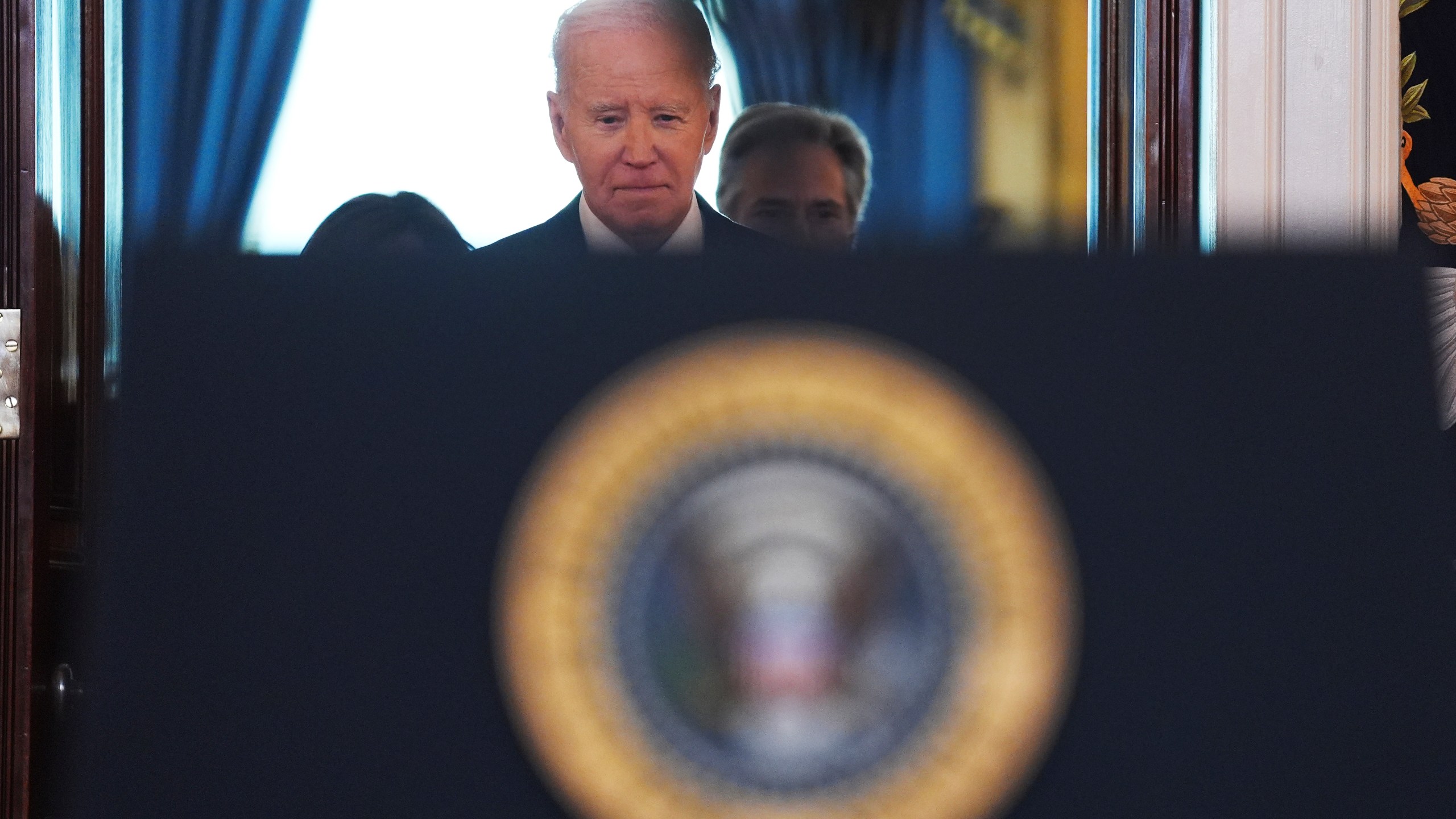 President Joe Biden walking up to the podium to speak in the Cross Hall of the White House on the announcement of a ceasefire deal in Gaza and the release of dozens of hostages after more than 15 months of war, Wednesday, Jan. 15, 2025, in Washington. (AP Photo/Evan Vucci)