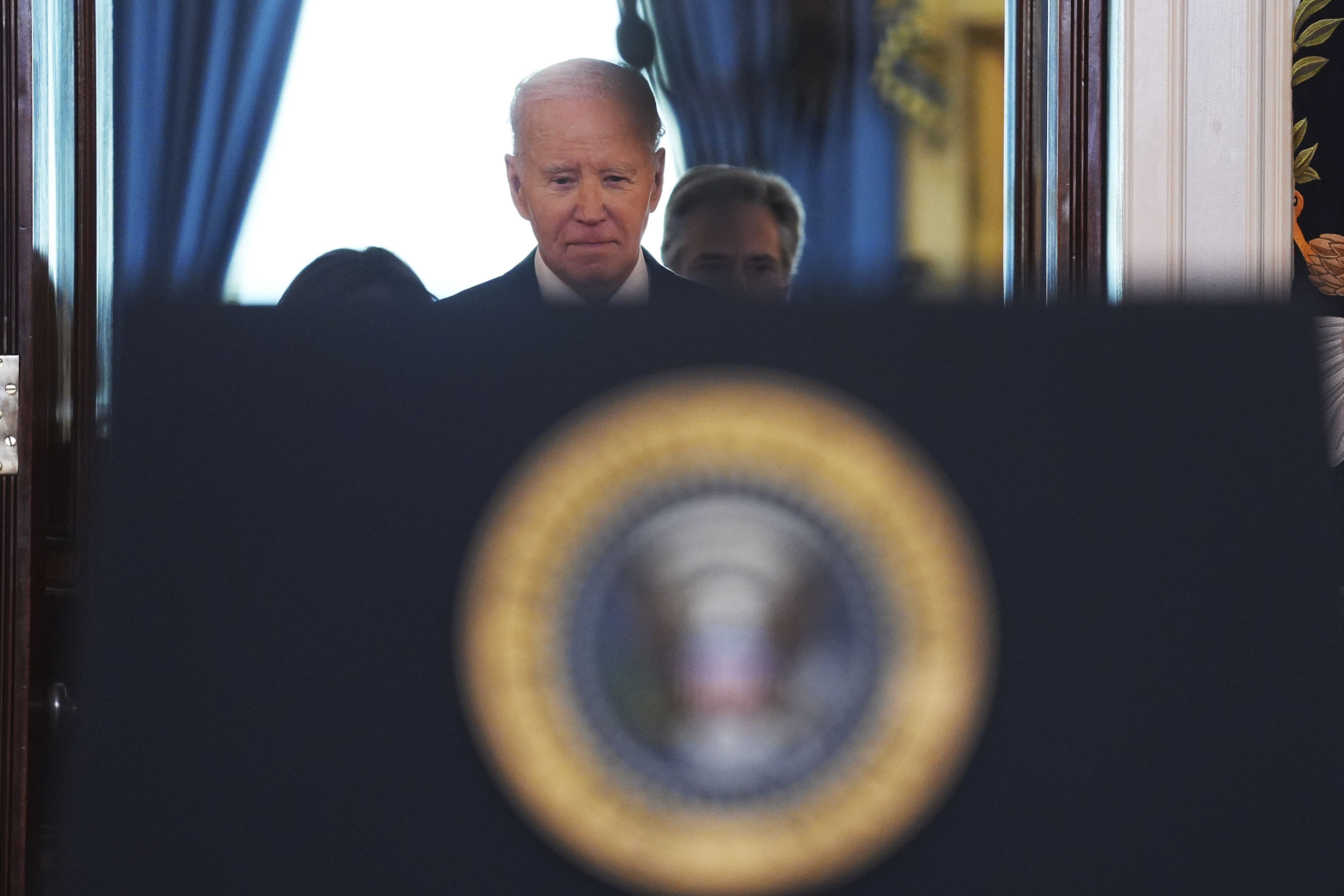 President Joe Biden walking up to the podium to speak in the Cross Hall of the White House on the announcement of a ceasefire deal in Gaza and the release of dozens of hostages after more than 15 months of war, Wednesday, Jan. 15, 2025, in Washington. (AP Photo/Evan Vucci)