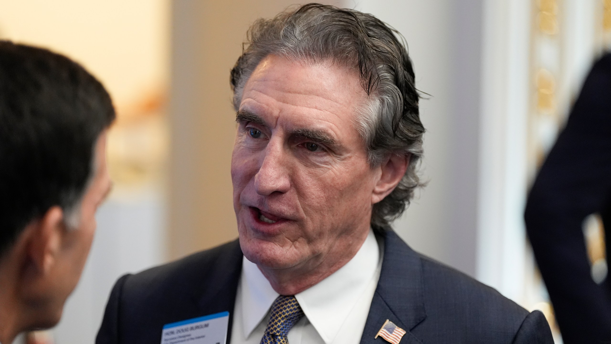 FILE - Gov. Doug Burgum, R-N.D., chats at the New York Stock Exchange before President-elect Donald Trump arrives to ring the opening bell, Dec. 12, 2024, in New York. (AP Photo/Alex Brandon, File)