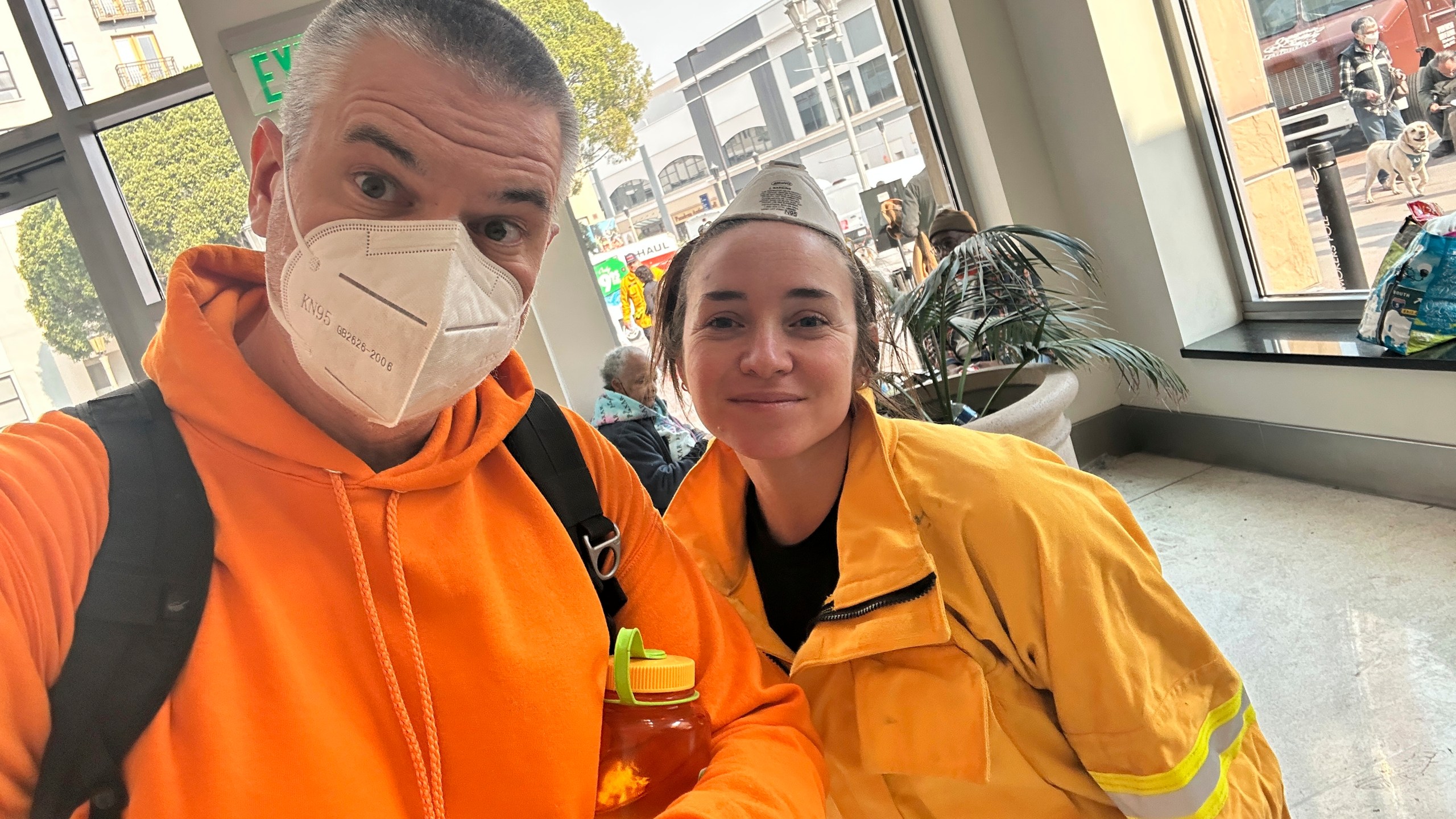 Ryan Pearson, a Los Angeles-based entertainment video editor for The Associated Press, and his colleague Krysta Fauria take a selfie at an evacuation center at the Pasadena Convention Center in Pasadena, Calif., as they interview evacuees Wednesday, Jan. 8, 2025. (AP Photo/Ryan Pearson)