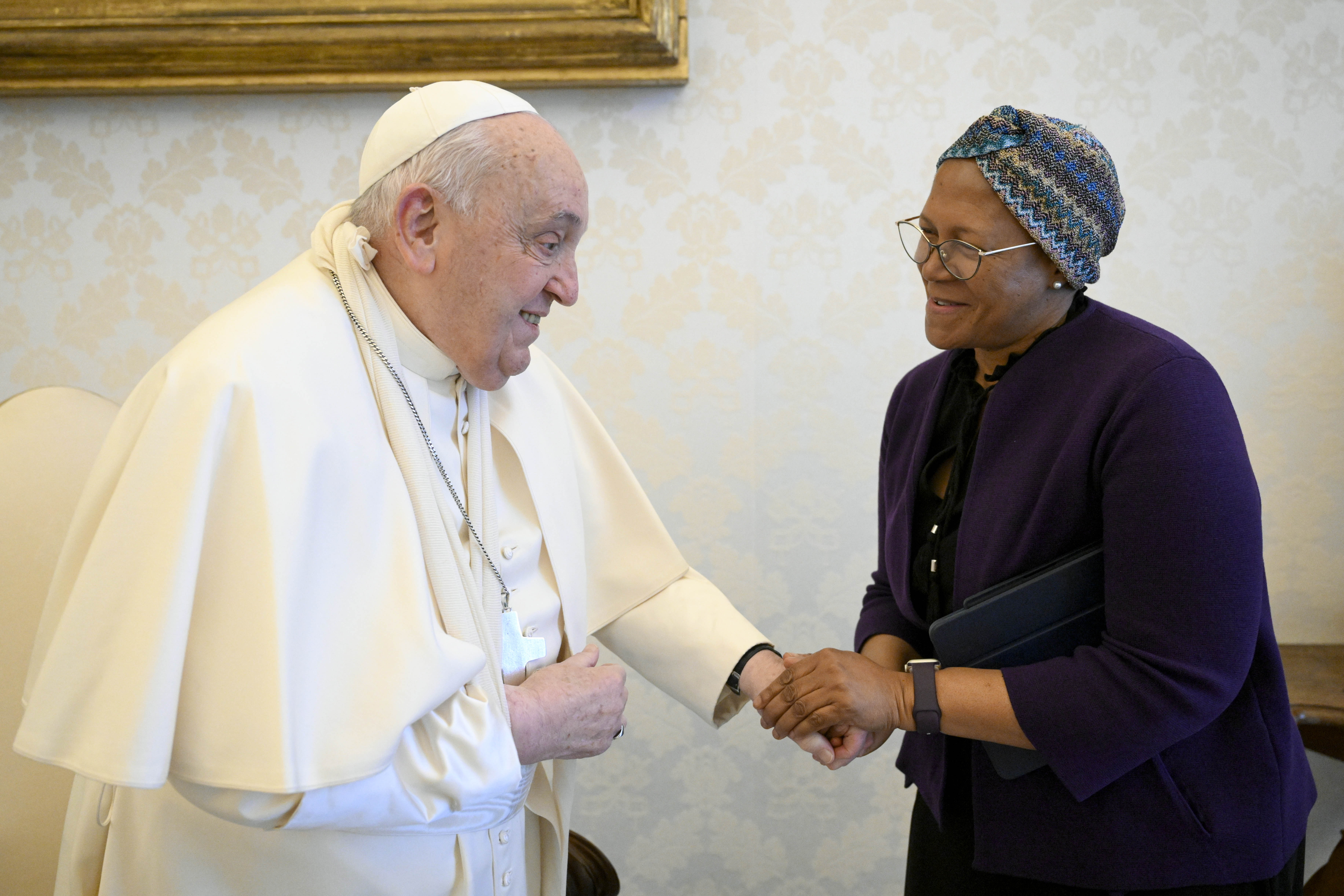 In this picture made available on Thursday, Jan. 16, 2025 by Vatican Media, Pope Francis wears a sling on his right arm, due to a fall earlier in the day, while meeting with FAO Programme Committee Chairperson on World Food Security Nosipho Nausca-Jean Jezile at The Vatican. (Vatican Media via AP, HOGP)