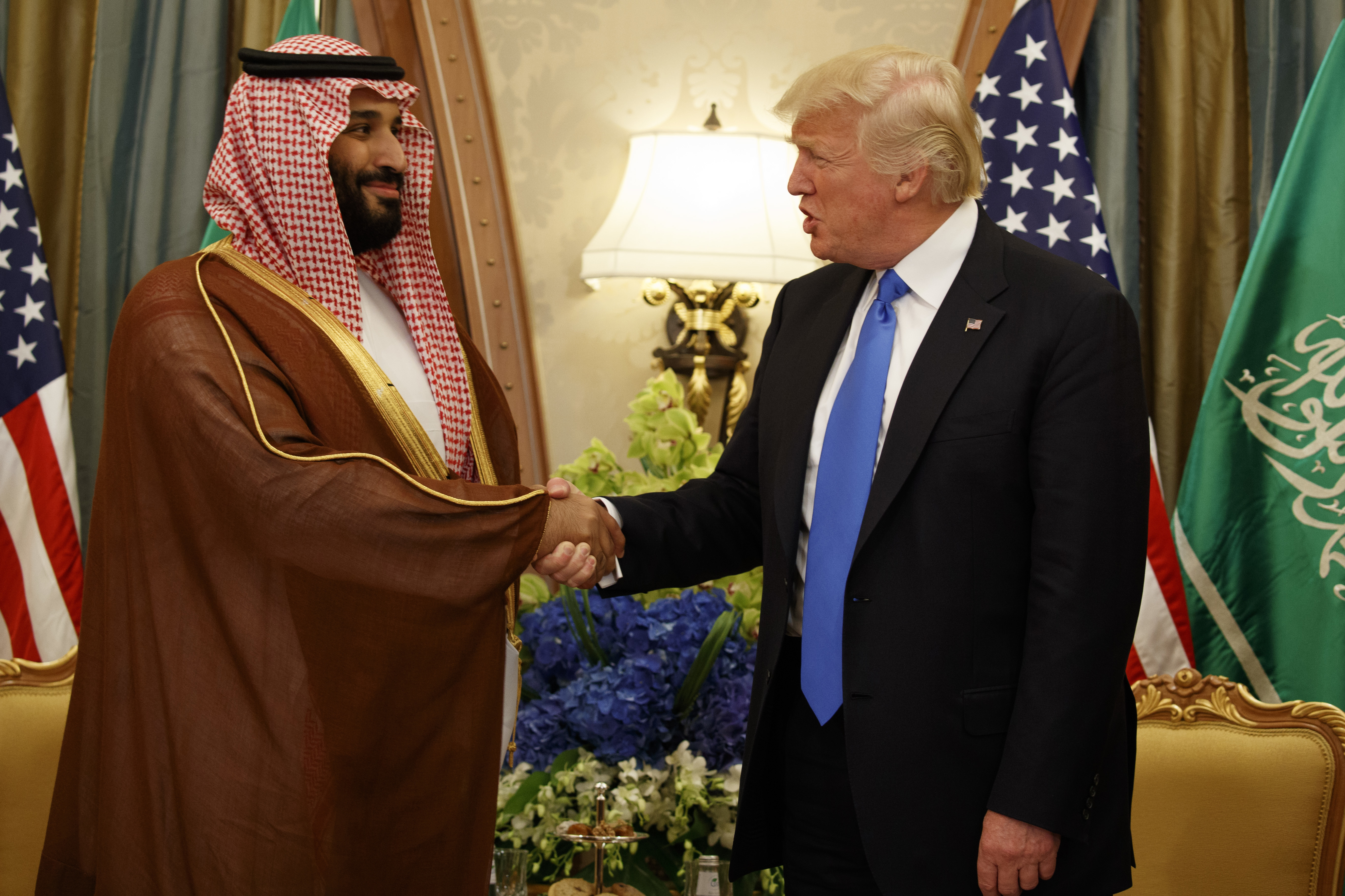 FILE- President Donald Trump shakes hands with Saudi Deputy Crown Prince and Defense Minister Mohammed bin Salman during a bilateral meeting, in Riyadh, May 20, 2017. (AP Photo/Evan Vucci, File)