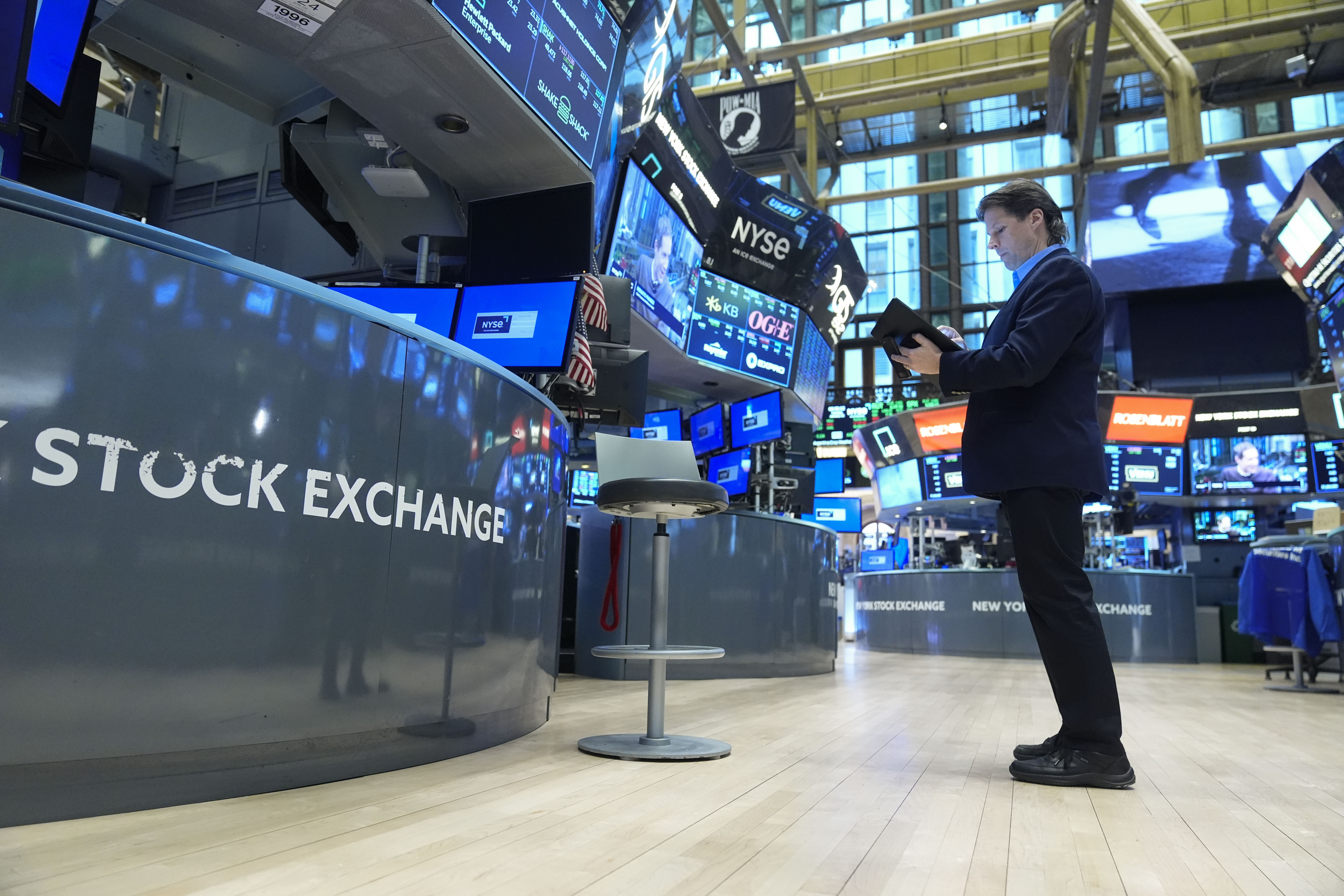 Traders work on the floor at the New York Stock Exchange in New York, Tuesday, Jan. 21, 2025. (AP Photo/Seth Wenig)