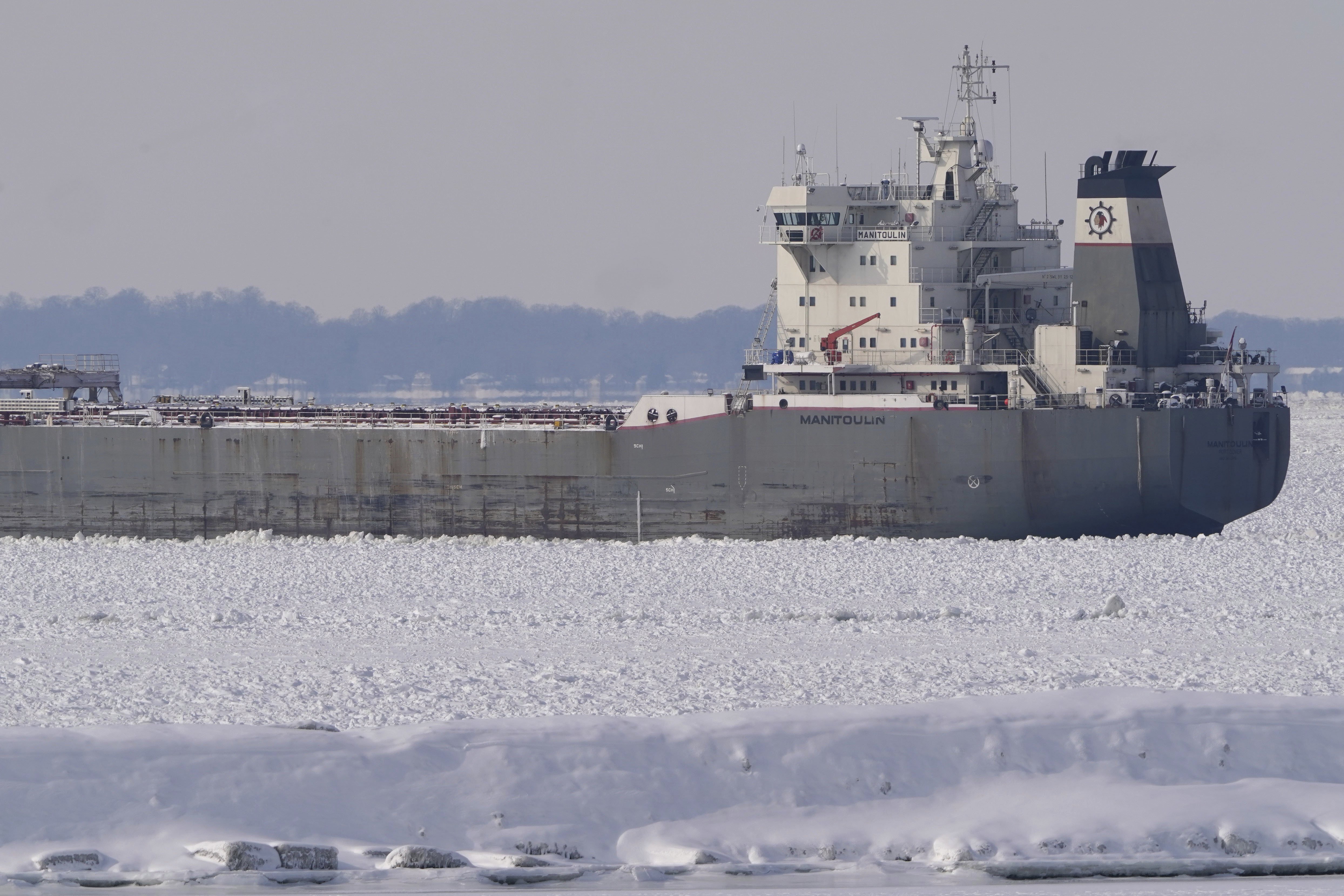 The lake freighter Manitoulin is immobilized by thick ice in Lake Erie outside the Buffalo River breakwall as it awaits the arrival of U.S. Coast Guard Cutter Bristol Bay which is en route from Erie, Penn. to help loosen the vessel, Thursday, Jan. 23, 2025. (Derek Gee/The Buffalo News via AP)