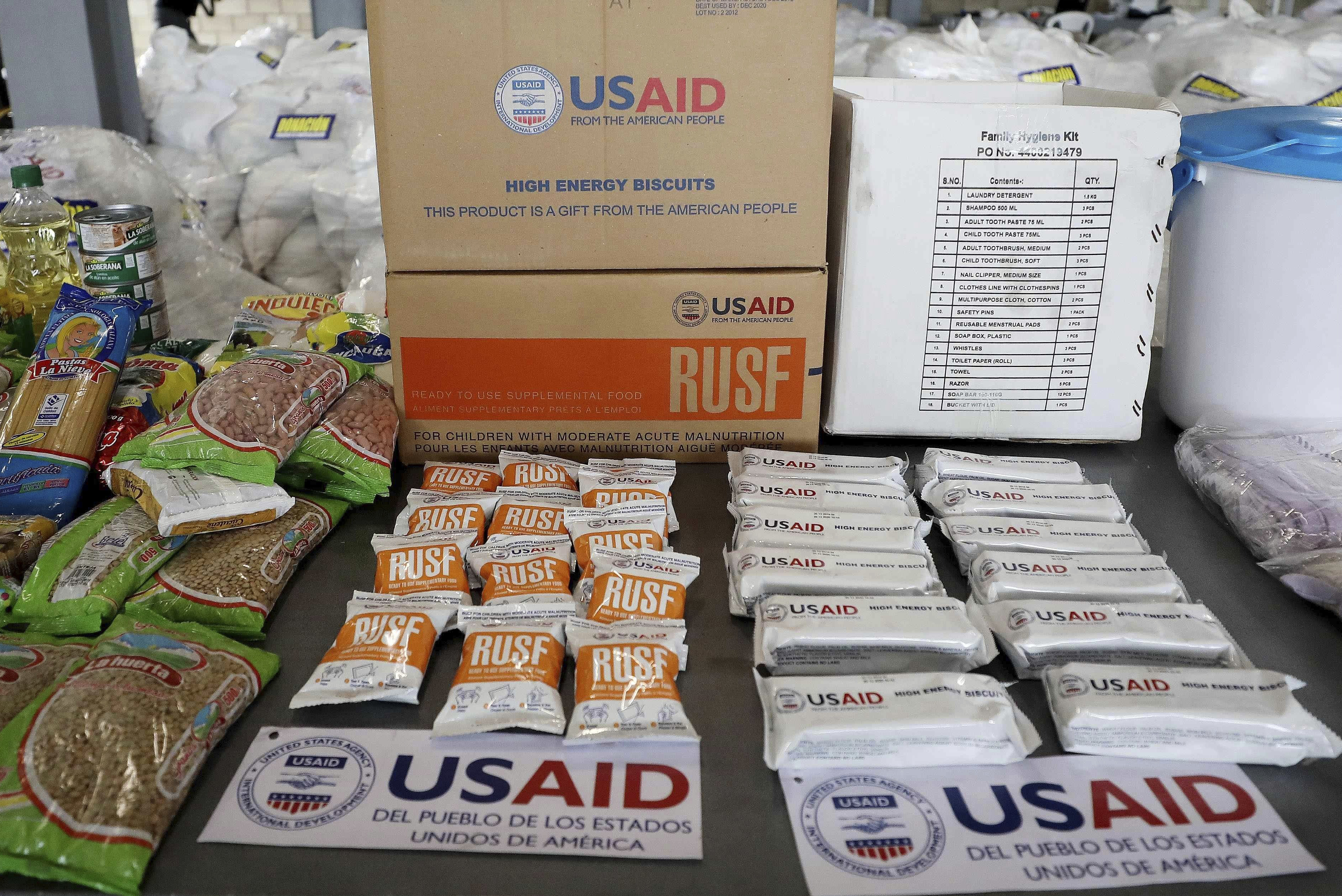 FILE - USAID humanitarian aid destined for Venezuela is displayed for the media at a warehouse next to the Tienditas International Bridge on the outskirts of Cucuta, Colombia, Feb. 19, 2019. (AP Photo/Fernando Vergara, File)