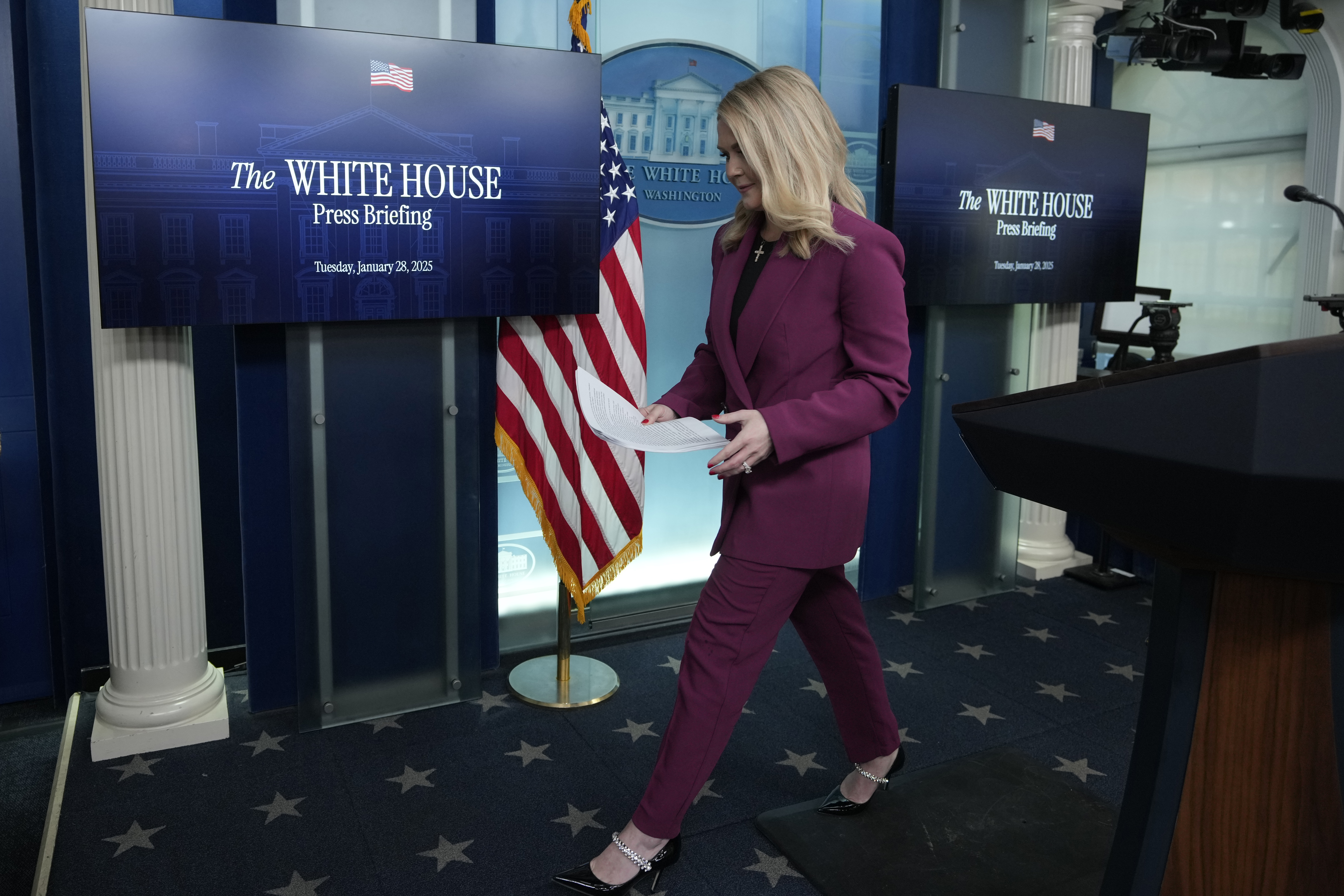 White House press secretary Karoline Leavitt walks off after speaking at the daily briefing at the White House in Washington Tuesday, Jan. 28, 2025. (AP Photo/Ben Curtis)