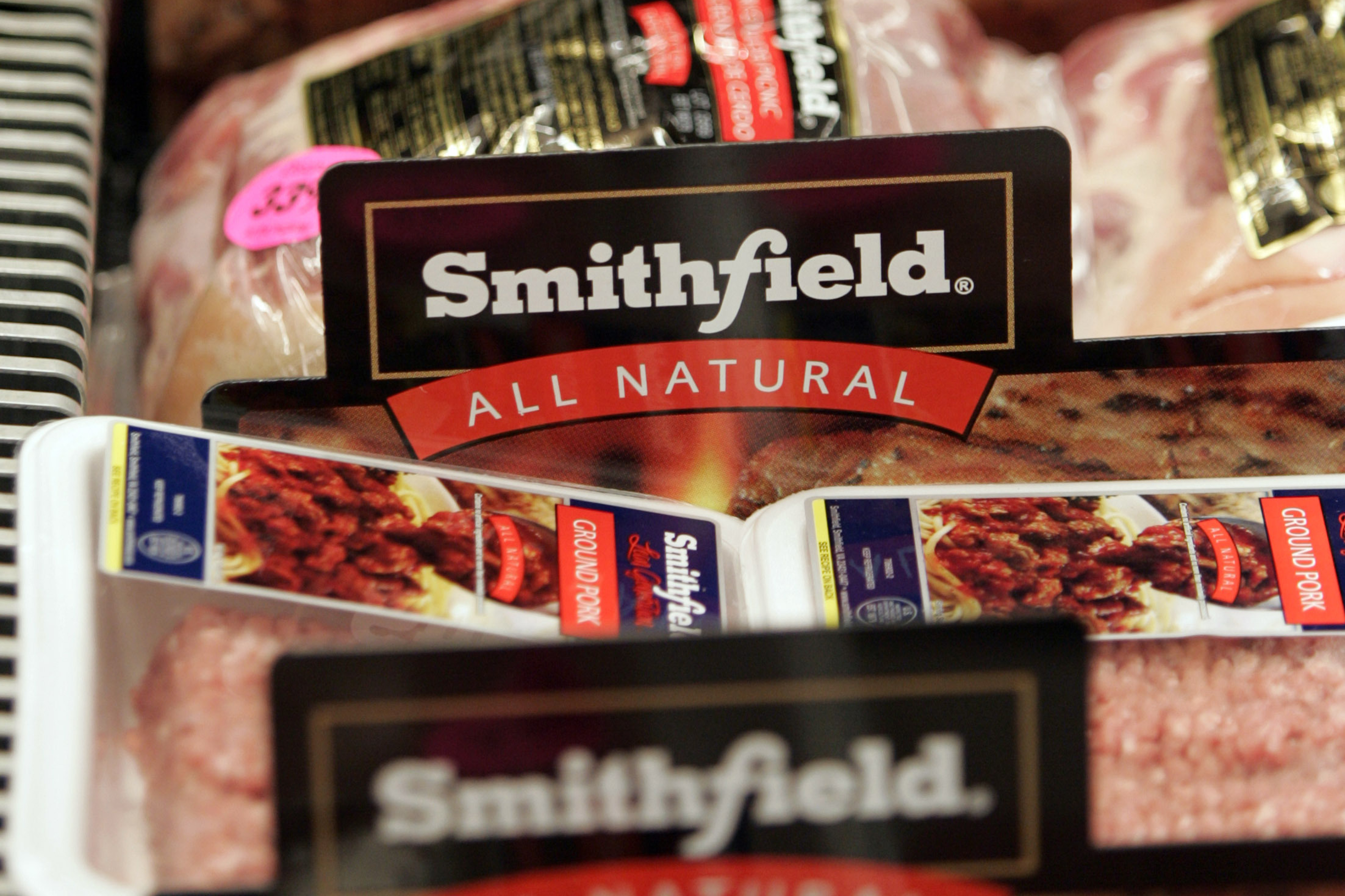 FILE - Smithfield Foods products are on display at the Ukrops store in Richmond, Va., March 10, 2009. (AP Photo/Steve Helber, File)