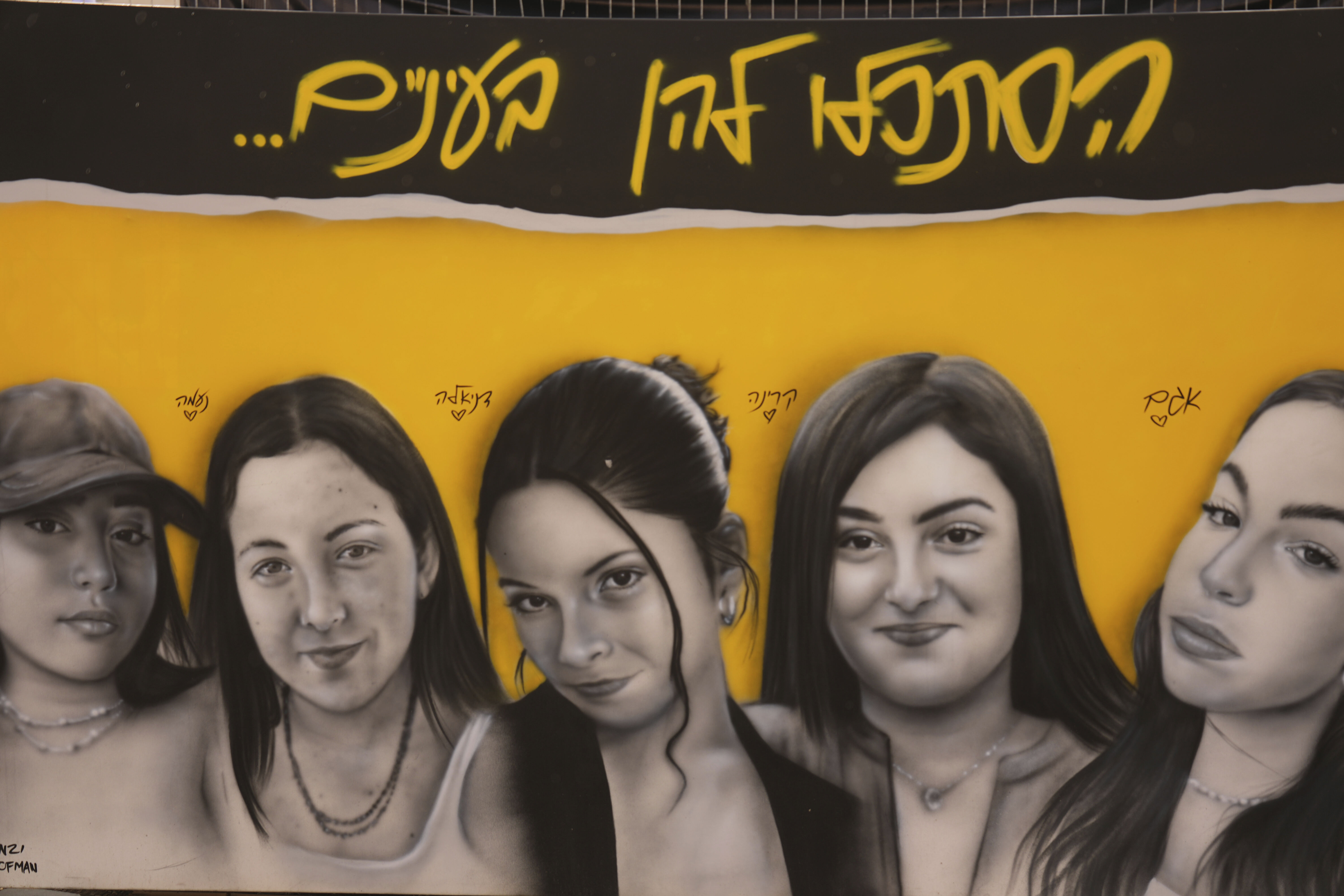 FILE - A mural of female Israeli soldiers who were abducted and brought to Gaza is displayed in Tel Aviv, Israel, Saturday, Jan. 25, 2025. (AP Photo/Ariel Schalit, File)