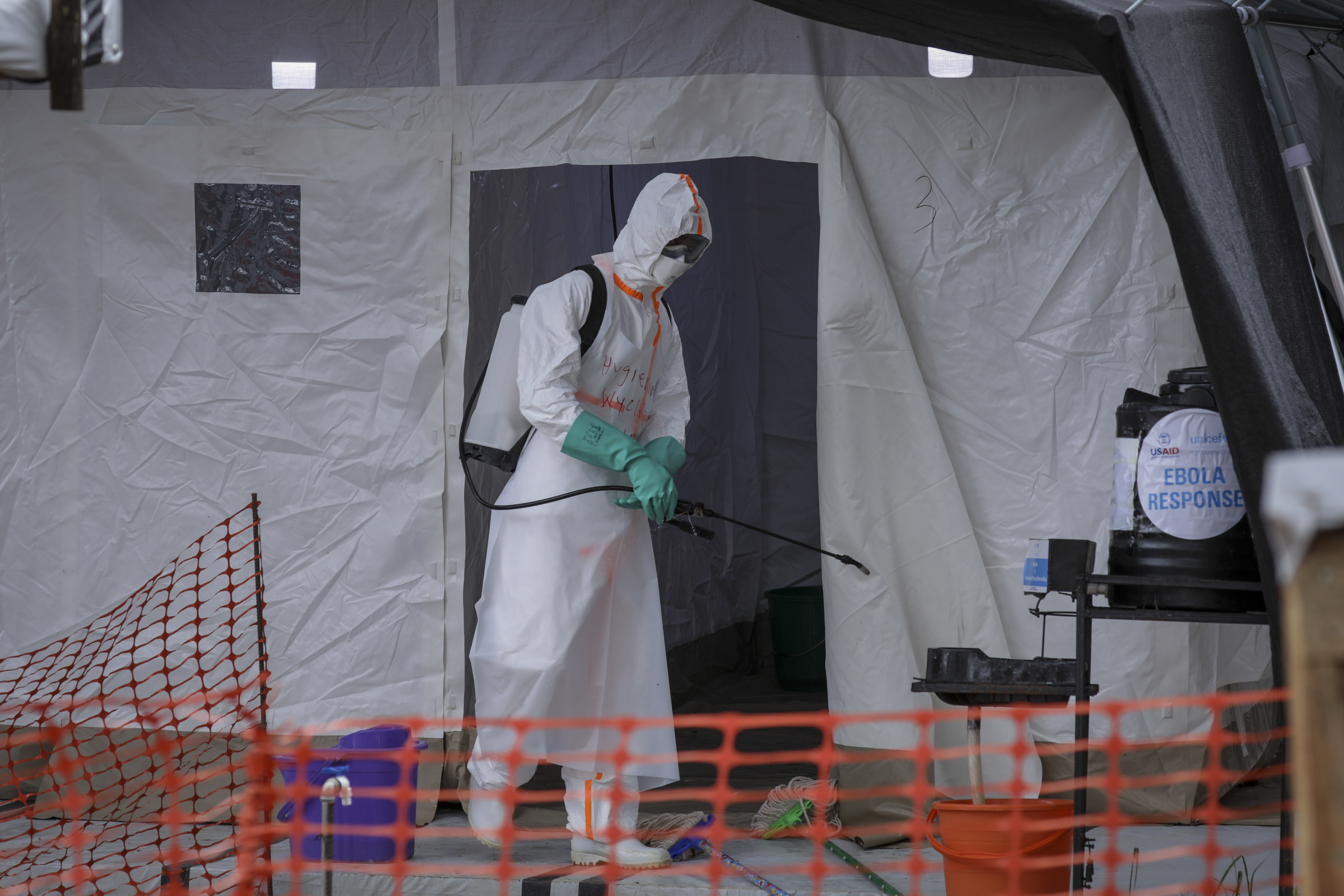 FILE - A medical worker disinfects a tent used for suspected Ebola victims inside the Ebola isolation center of Madudu Health Center III, in the village of Madudu, in the Mubende district of Uganda Tuesday, Nov. 1, 2022. (AP Photo/Hajarah Nalwadda, File)