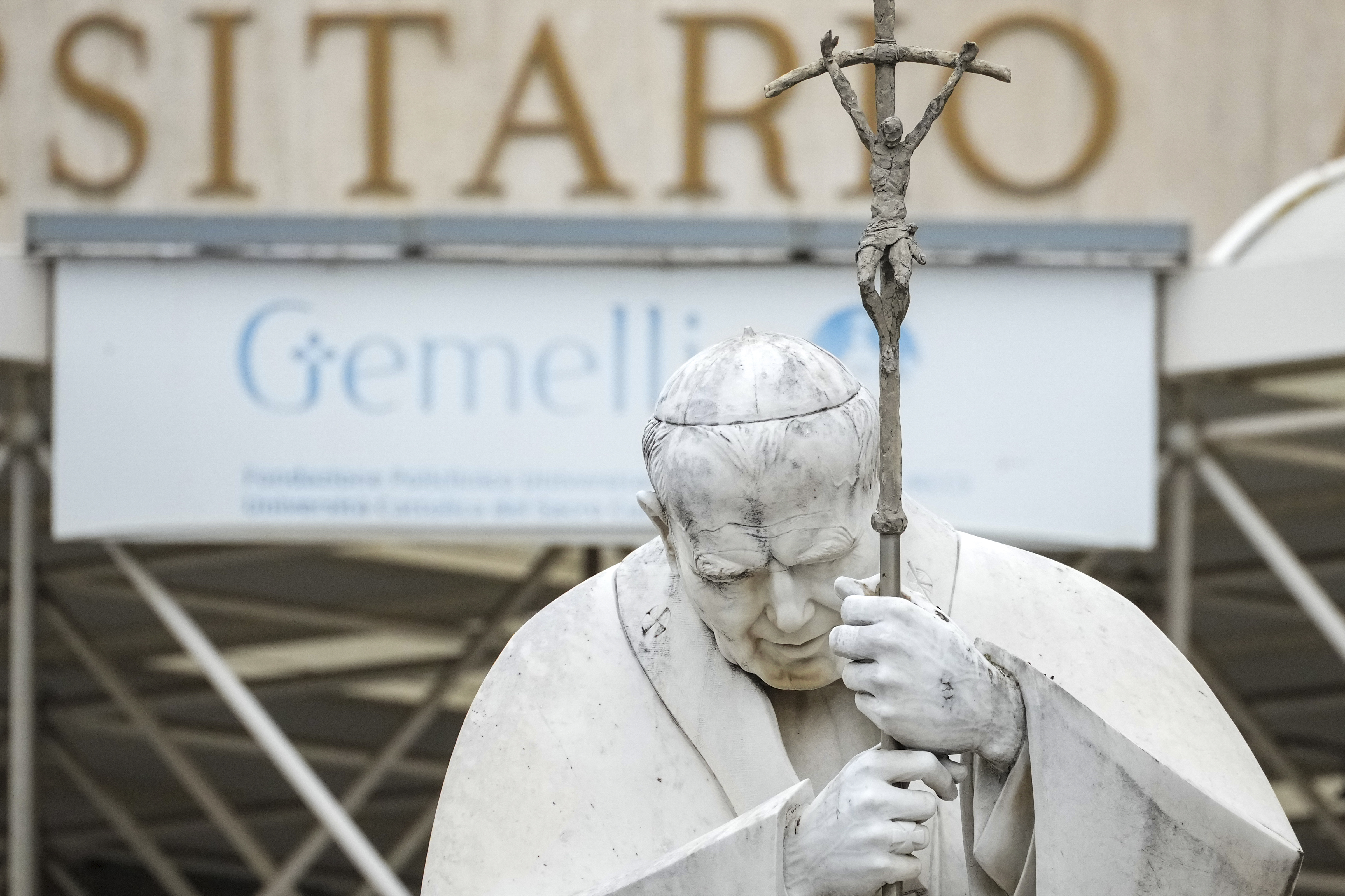 A statue of Pope John Paul II is seen in front of the Agostino Gemelli Polyclinic, in Rome, Tuesday, Feb. 18, 2025, where Pope Francis has been hospitalised to undergo some necessary diagnostic tests and to continue his ongoing treatment for bronchitis. (AP Photo/Andrew Medichini)