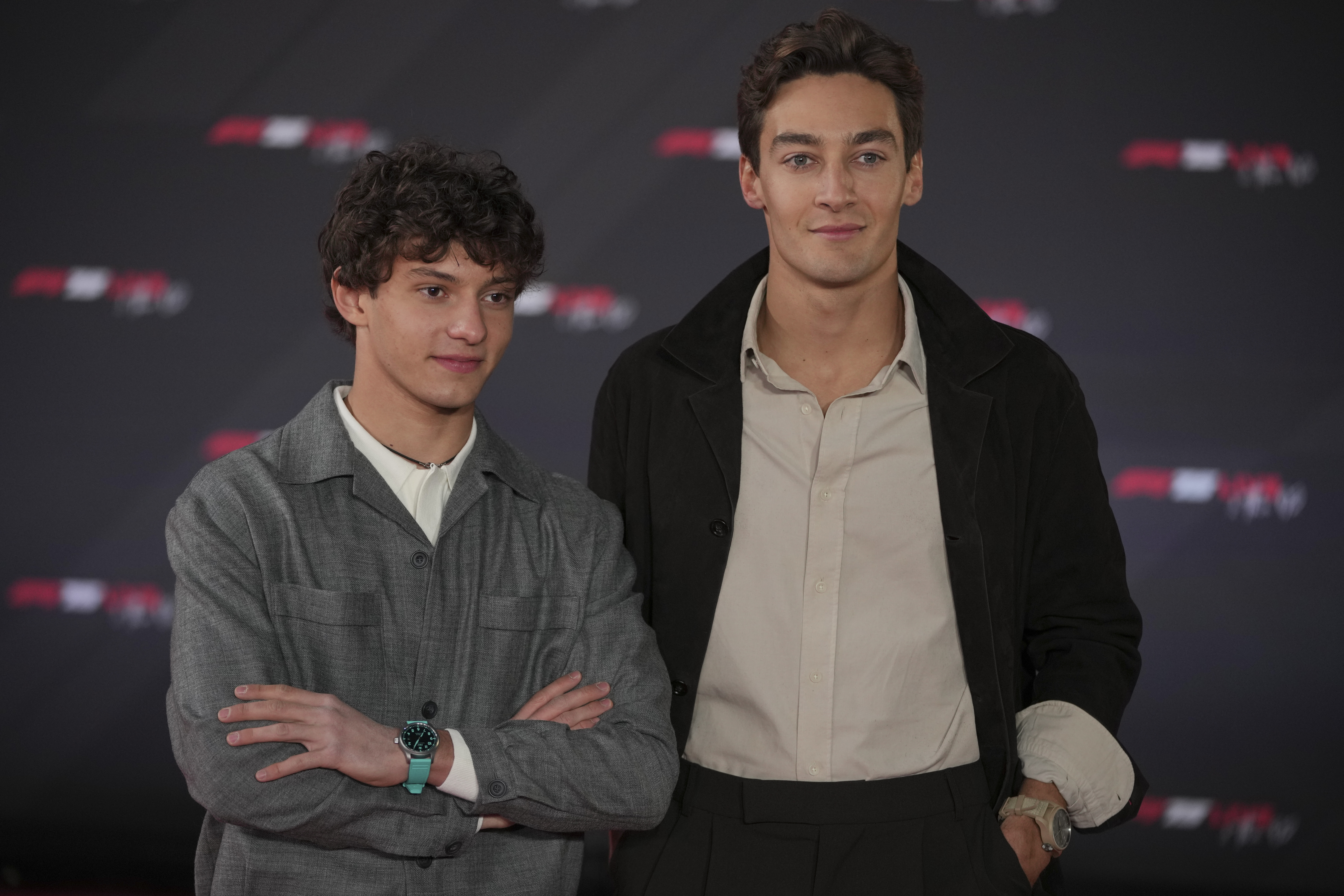 Mercedes driver Andrea Kimi Antonelli of Italy, left, and Mercedes driver George Russell of Britain, pose for cameras as they arrive to the F1 75 Live launch event at the O2 arena in London, Tuesday, Feb. 18, 2025. (AP Photo/Kin Cheung)