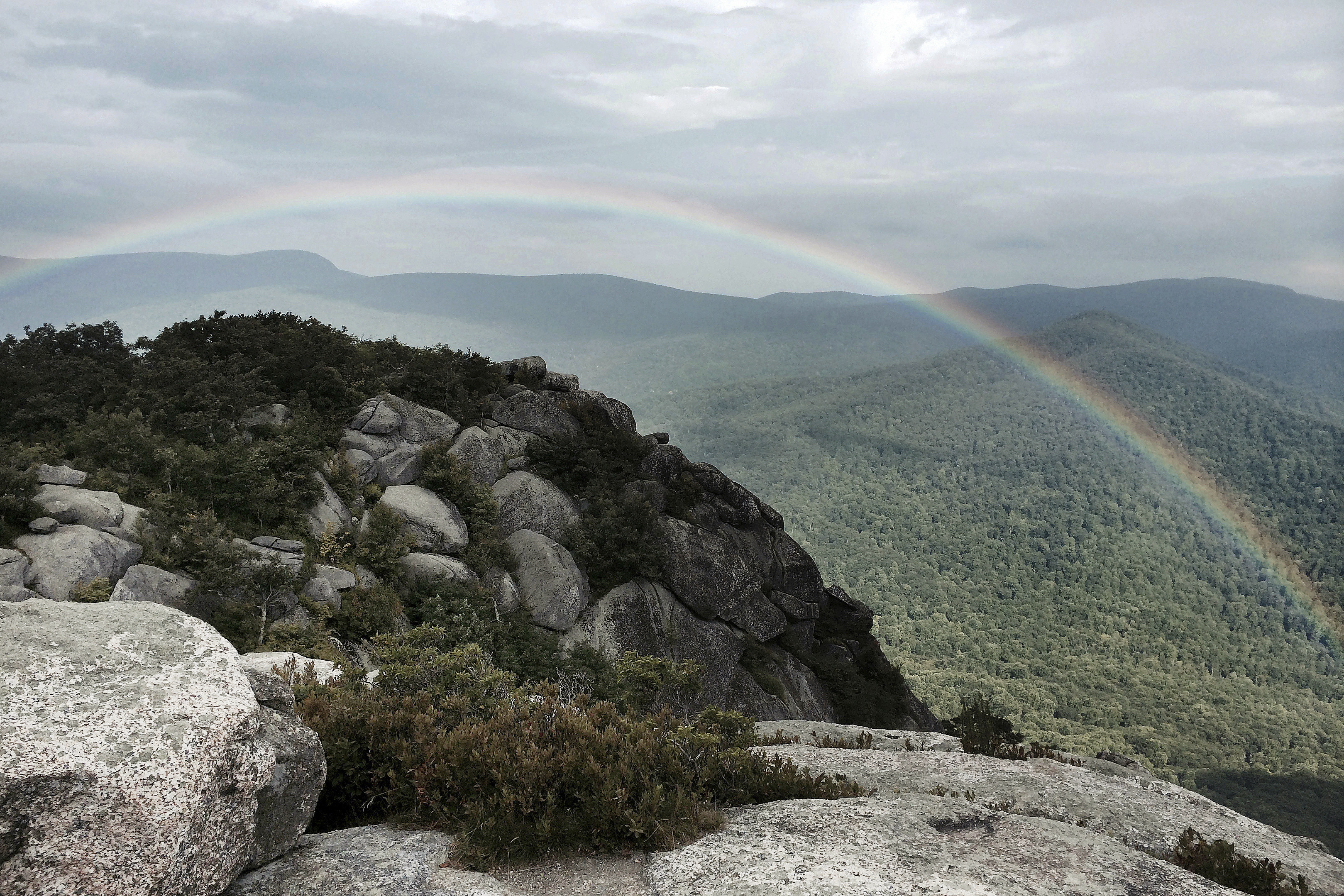 FILE - In this undated photo, a rainbow appears after a hike to the top of Old Rag Mountain in Shenandoah National Park near Sperryville in Madison County, Va. (Frank Green/Richmond Times-Dispatch via AP, File)