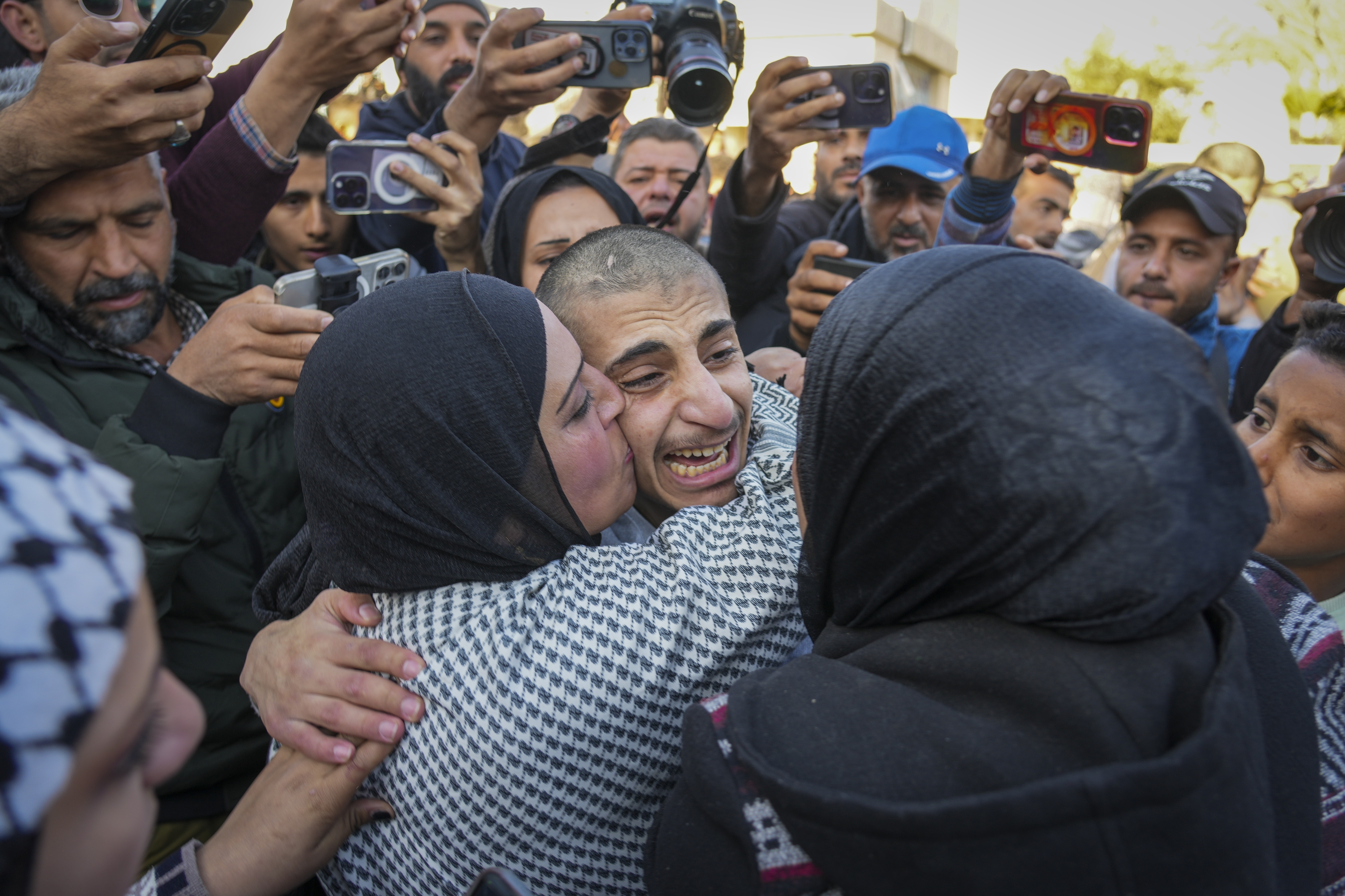 Mohammed Sahloul, 17, is greeted by his sister Nidaa after being released from an Israeli prison in Khan Younis, Gaza Strip, Thursday, Feb. 27, 2025. (AP Photo/Abdel Kareem Hana)