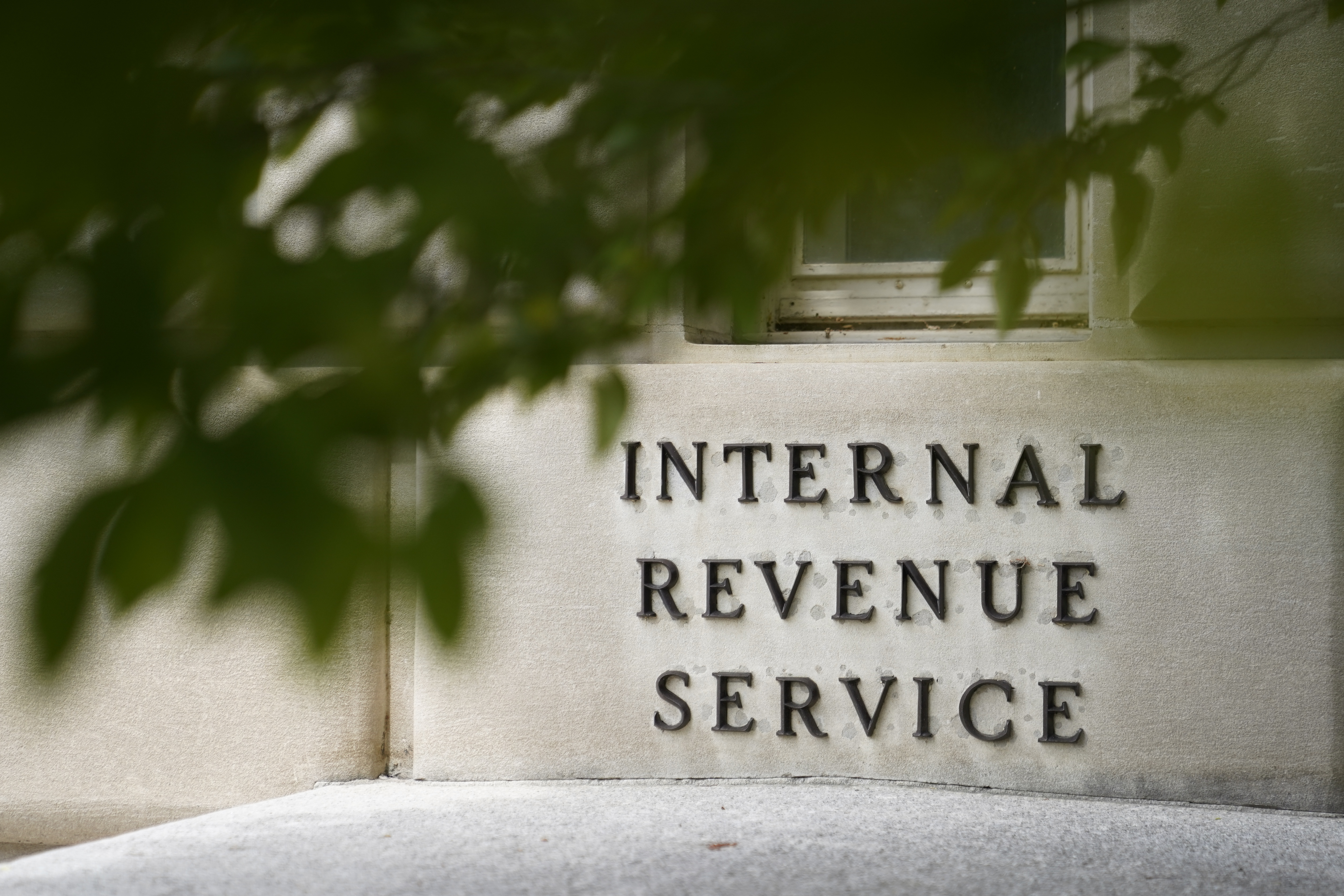 FILE - The sign outside the Internal Revenue Service building is seen. May 4, 2021, in Washington. (AP Photo/Patrick Semansky, File)