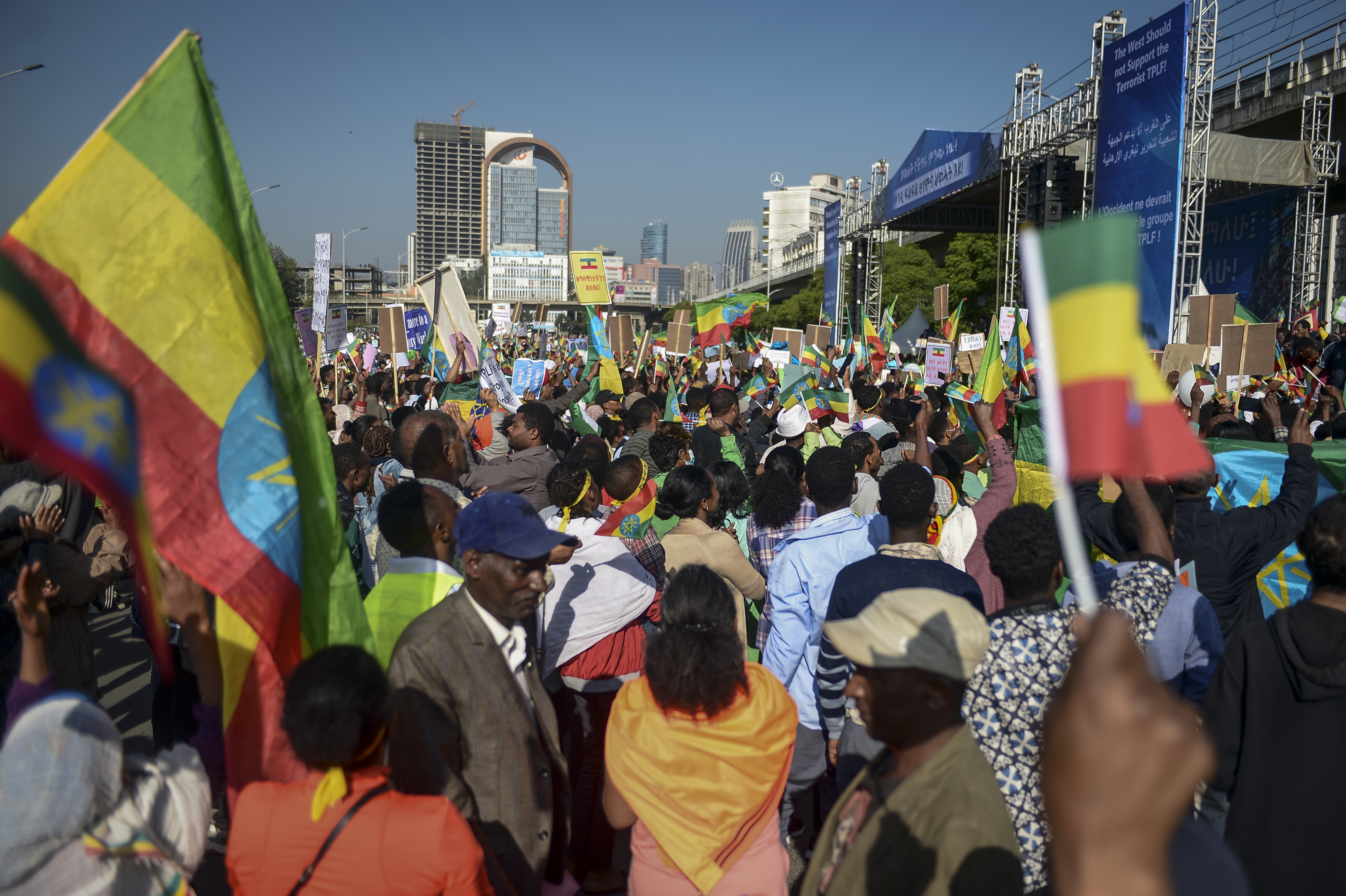 FILE - Ethiopians holding national flags protest against what they say is interference by outsiders in the country's internal affairs and against the Tigray People's Liberation Front (TPLF), the party of Tigray's fugitive leaders, at a rally organized by the city administration in the capital Addis Ababa, Ethiopia Saturday, Oct. 22, 2022. (AP Photo, File)